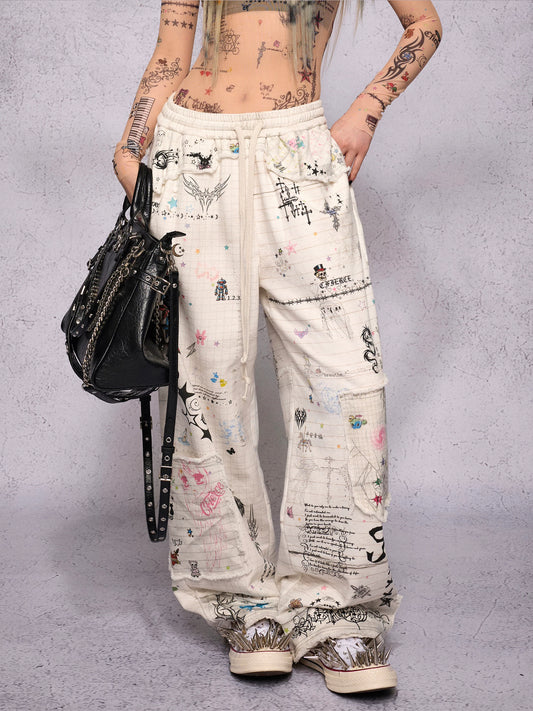 CFIERCE Distressed Manuscript Graphic Sweatpants - white graphic sweatpants front on model