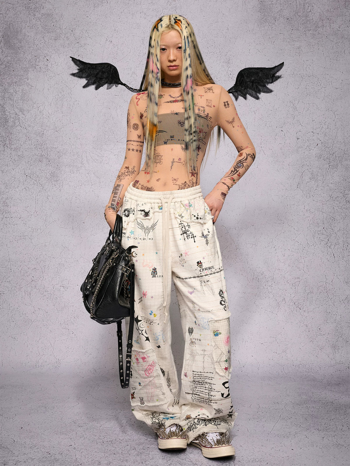 CFIERCE Distressed Manuscript Graphic Sweatpants - white graphic sweatpants print and fit on model