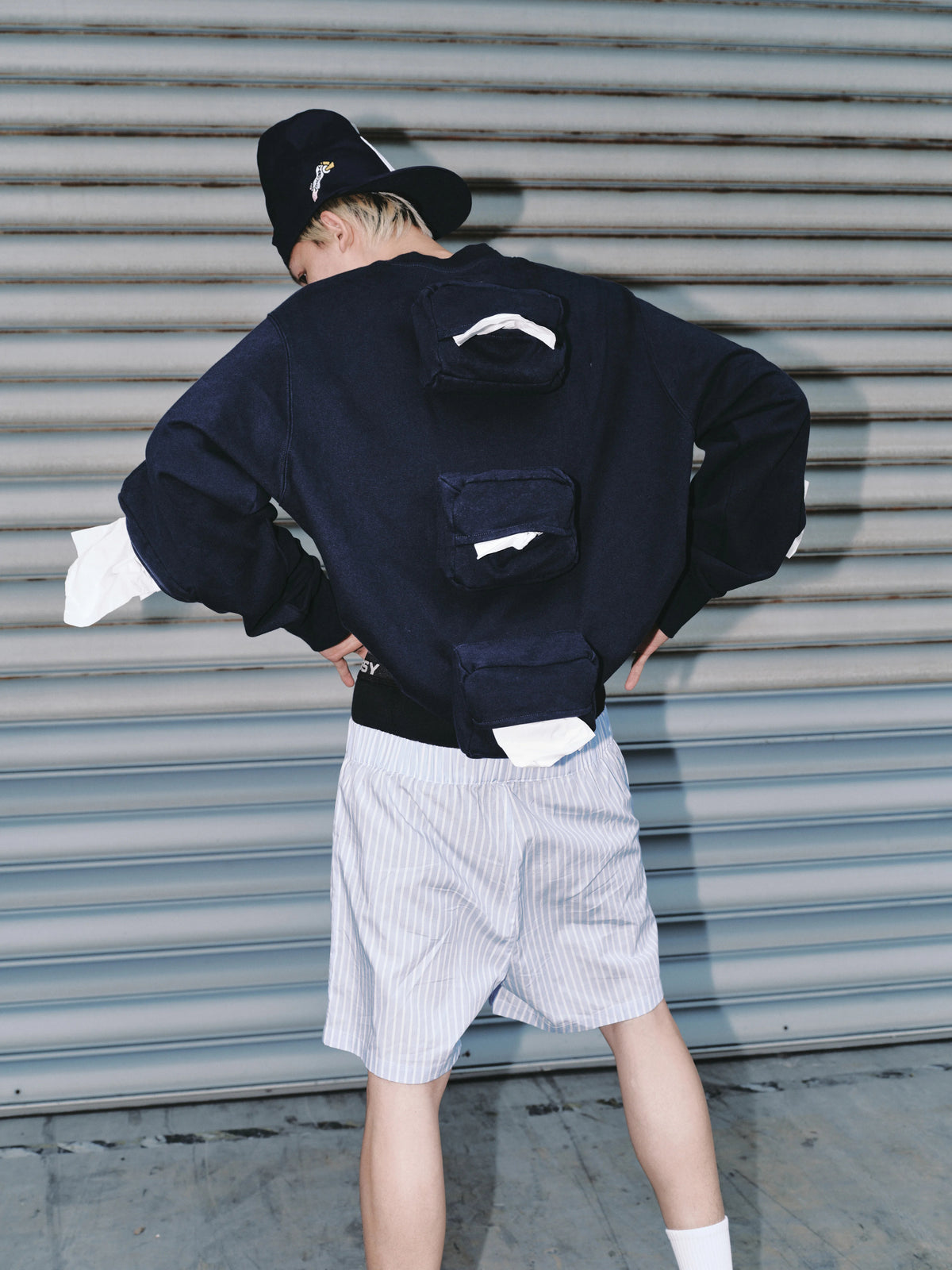 USIC sky blue striped shorts, rear view on model