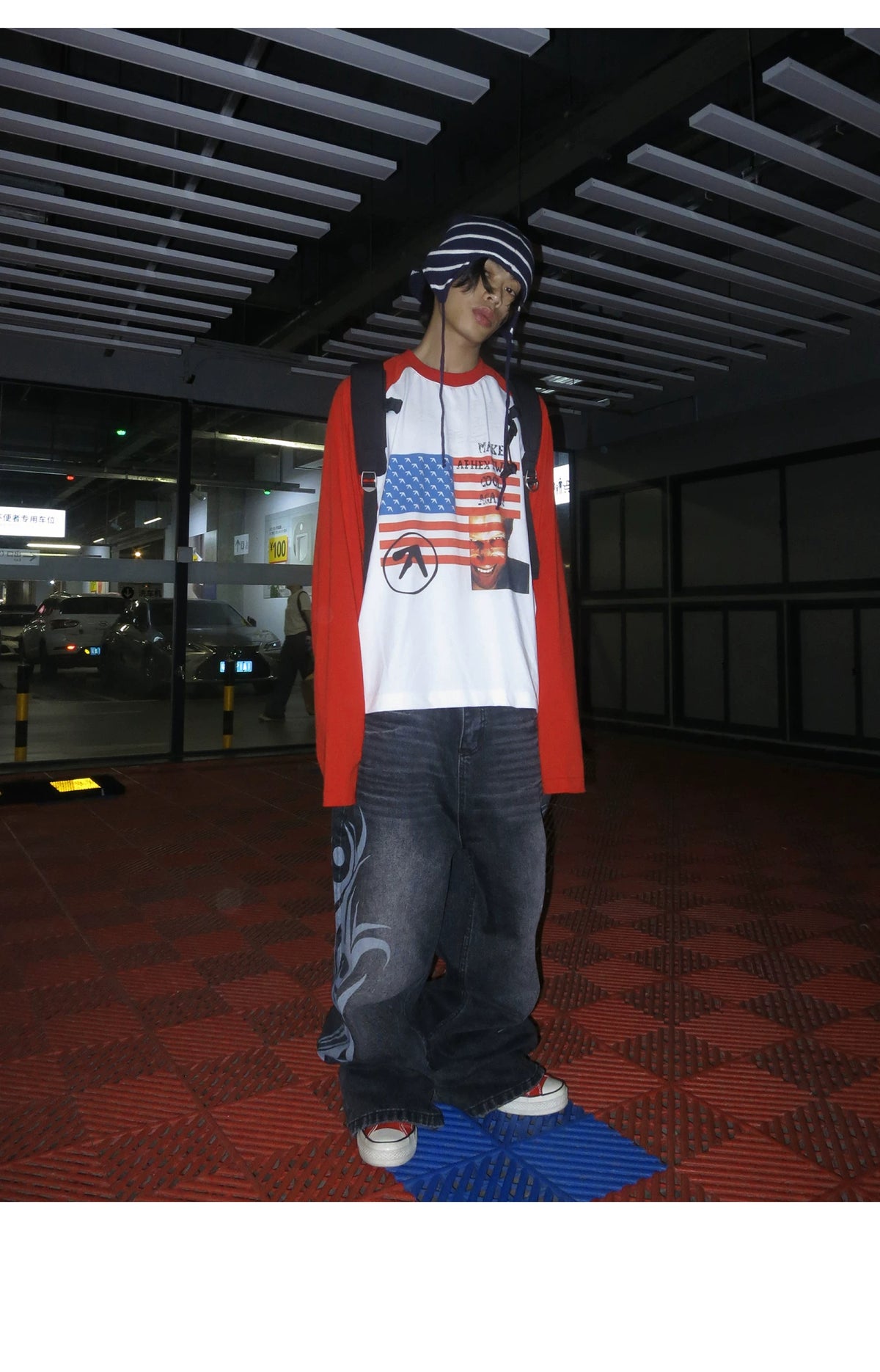 RAINMAKE Flag Parody Graphic Raglan Long Sleeve Tee - White on model