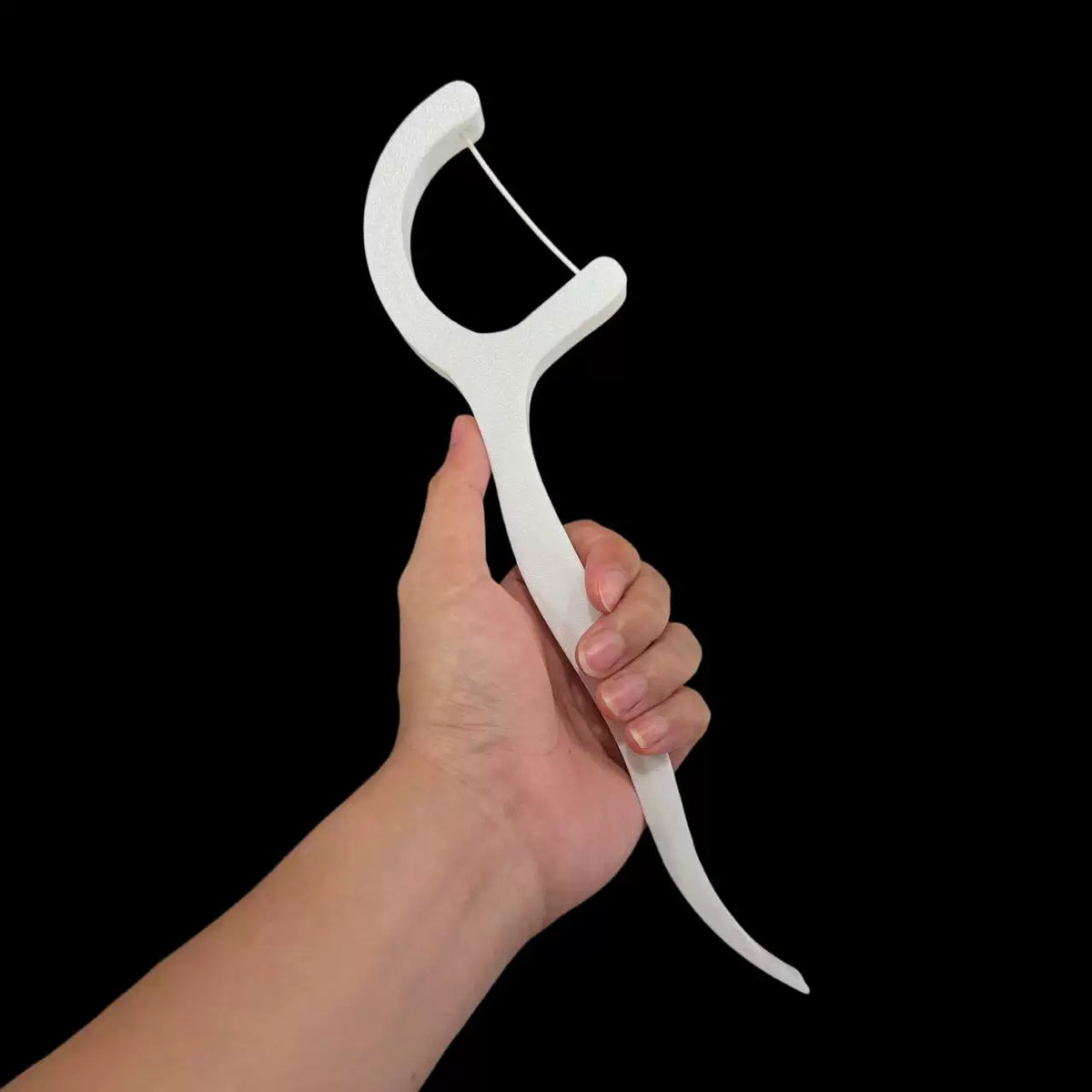 White dental-floss-pick-shaped decor without light