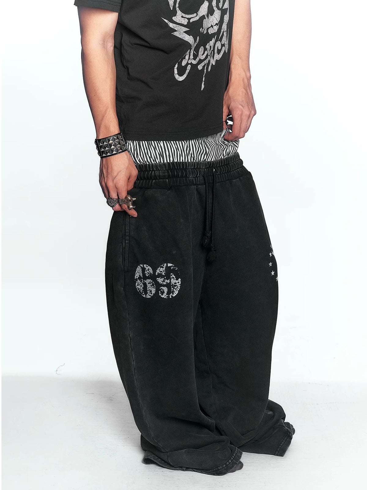 Washed Double Waistband Distressed Print Sweatpants - Washed Black front prints detail