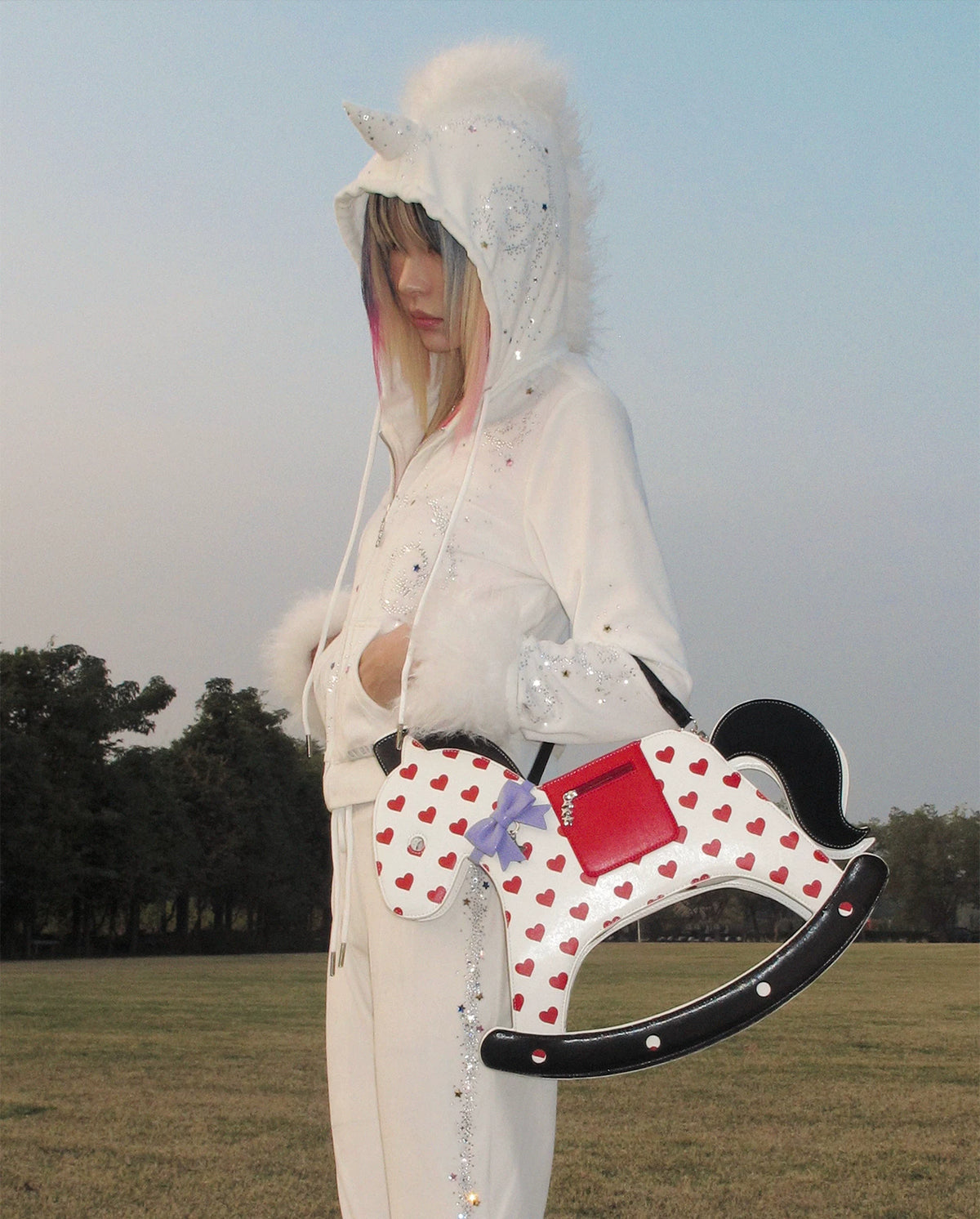CFIERCE Rocking Horse Crossbody Handbag - red heart rocking-horse handbag worn with pale outfit