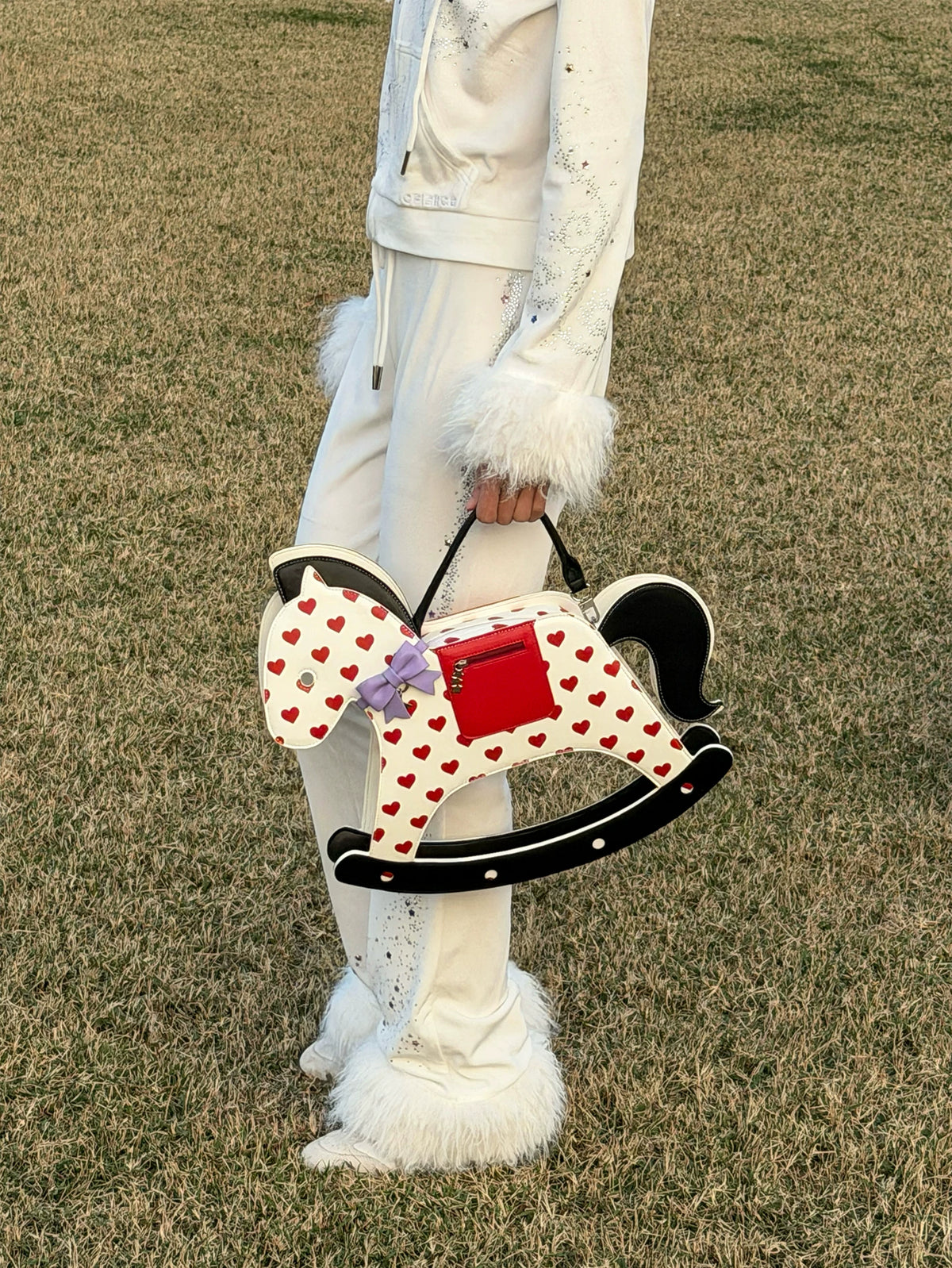CFIERCE Rocking Horse Crossbody Handbag - red heart rocking-horse handbag held at side