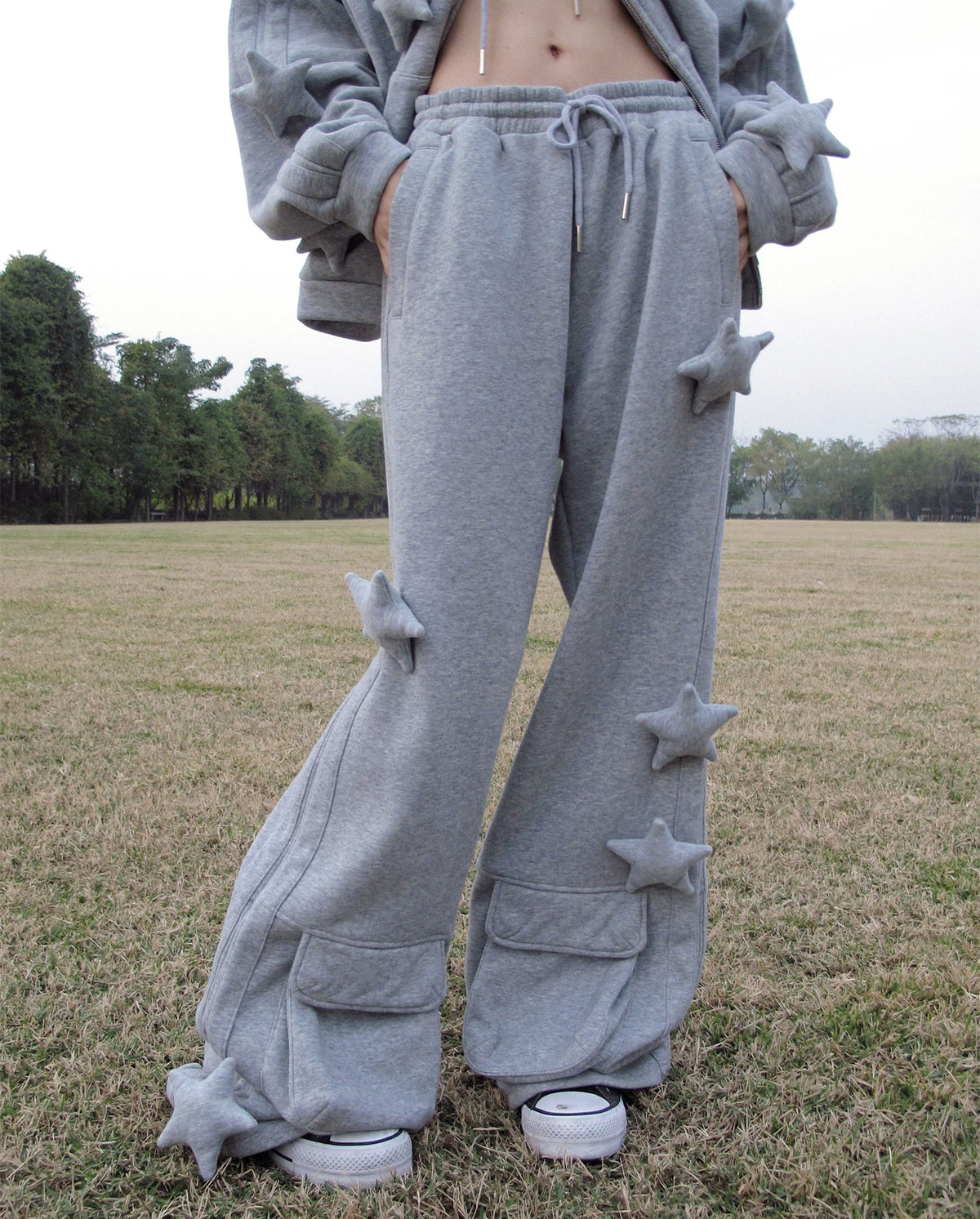 CFIERCE Raised Star Flared Sweatpants - gray raised-star flared sweatpants close worn front