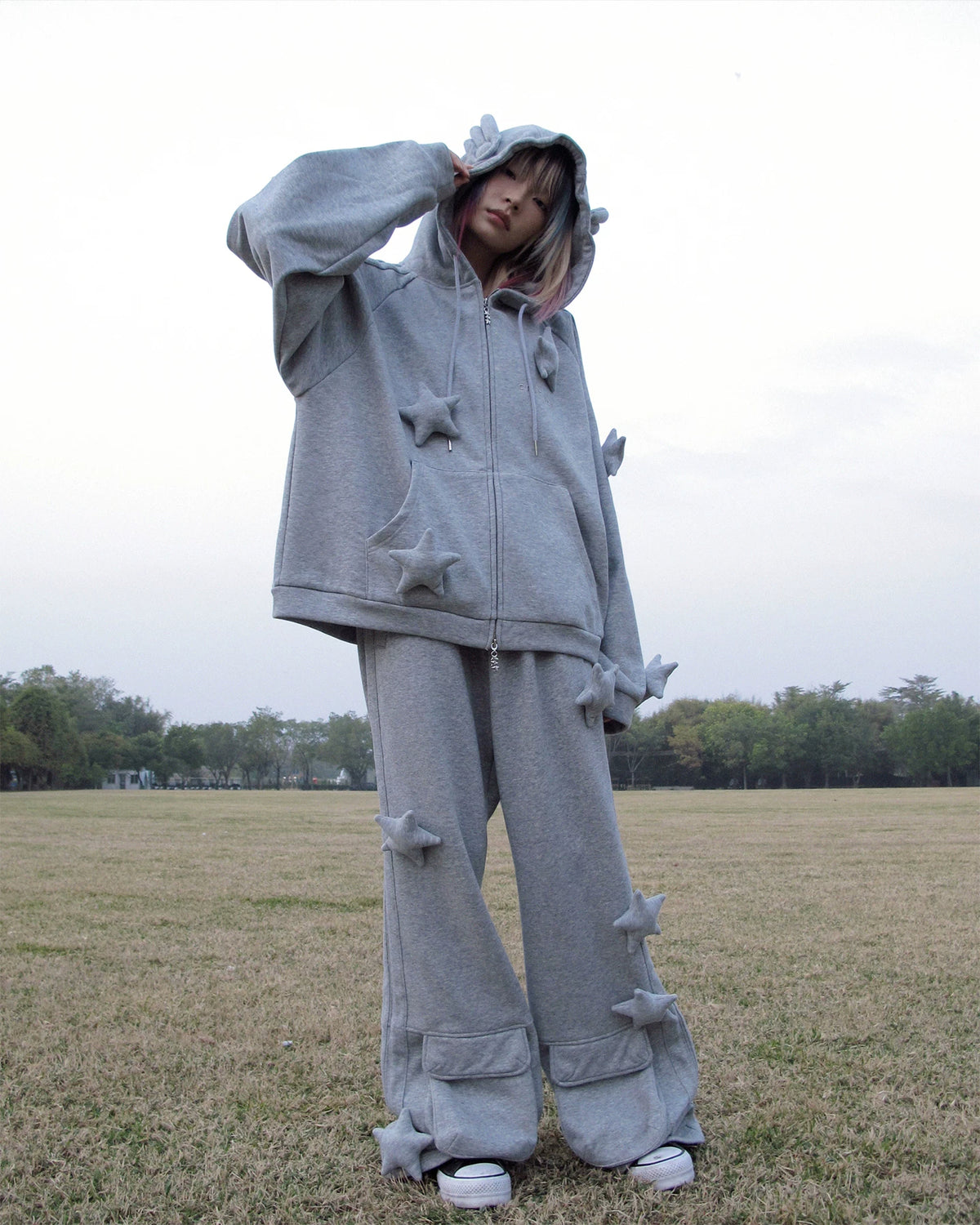 CFIERCE Raised Star Flared Sweatpants - gray raised-star flared sweatpants worn from side