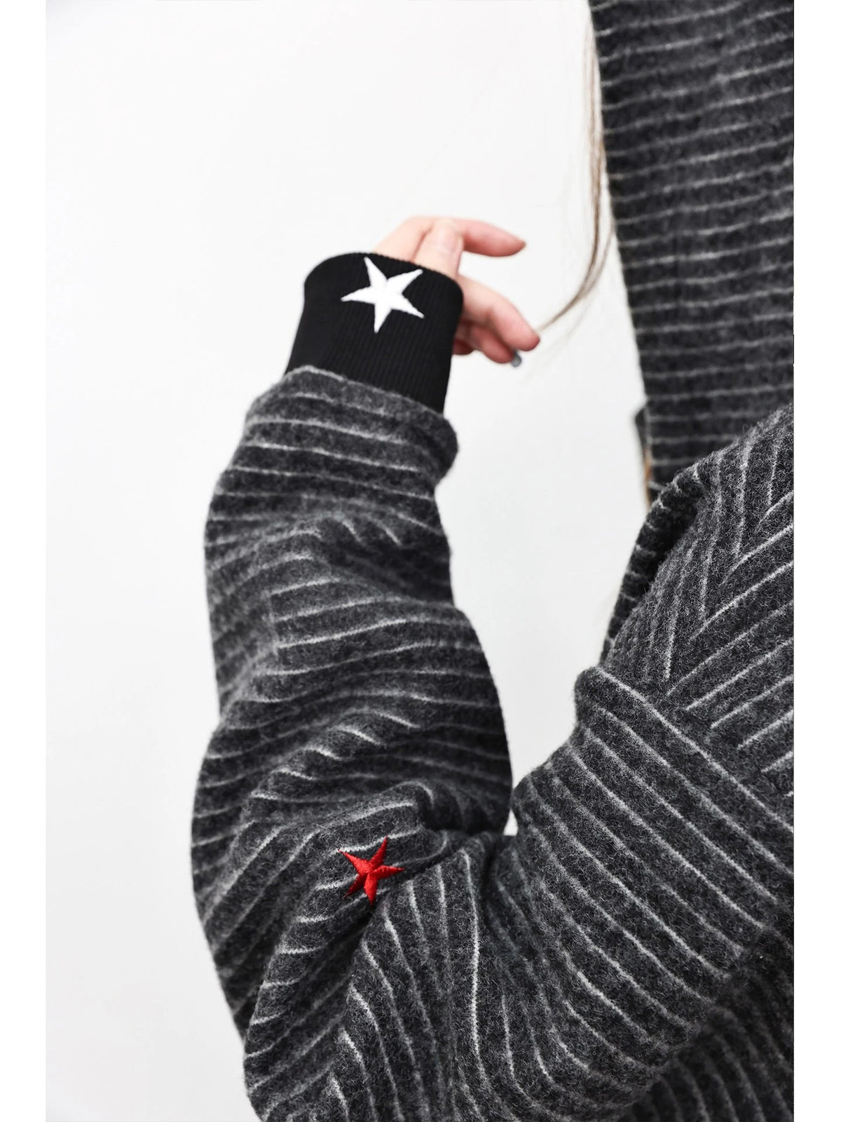 WANNA LAB Star Unicorn Embroidered Fuzzy Striped Cropped Zip-Up Hoodie - Black Stripe sleeve and star cuff detail on model
