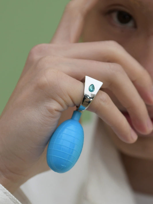 USIC water-squirting ring and blue bulb, product or on-hand view