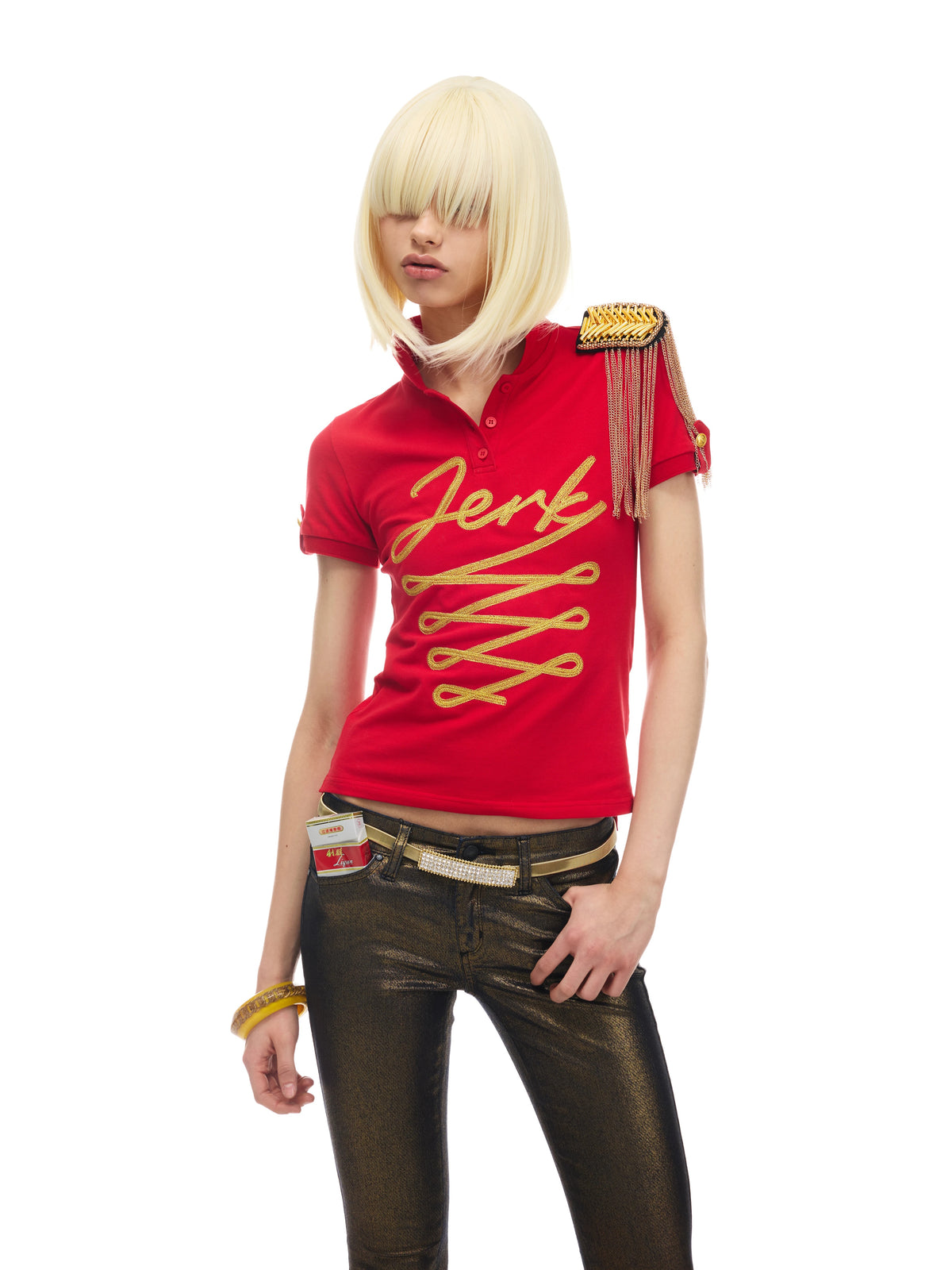 NORGIRA Red Jerk Gold-Embroidered Polo Shirt - red gold embroidered polo on model, front three-quarter view; shoulder epaulette is styling prop