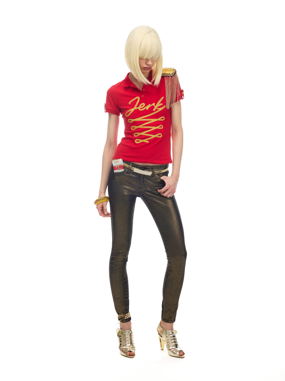 NORGIRA Red Jerk Gold-Embroidered Polo Shirt - red gold embroidered polo on model, full length look; shoulder epaulette is styling prop