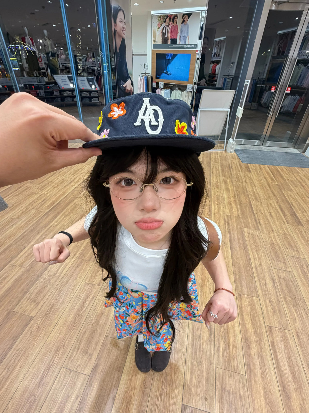 SANB Hwa cap worn indoors, front view