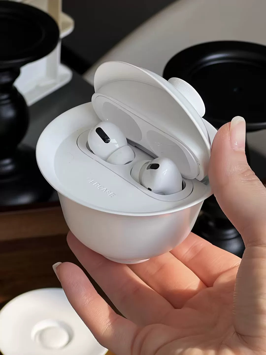 White teacup AirPods case — original product photo 6; earbuds not included