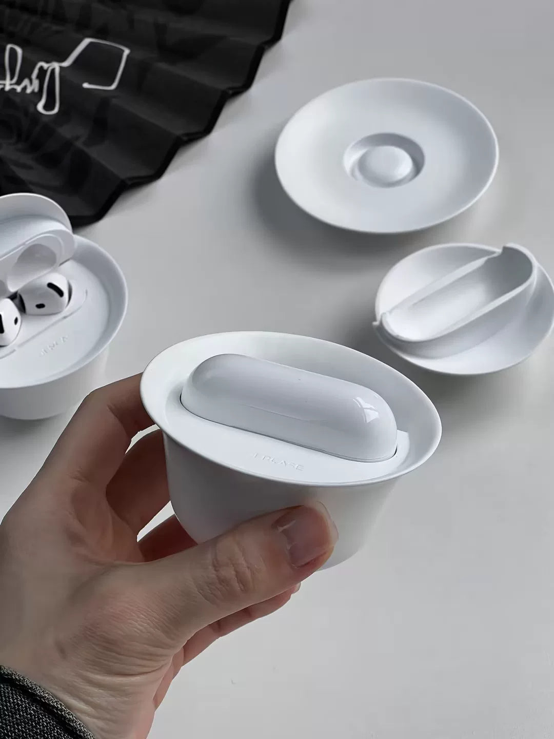 White teacup AirPods case — original product photo 8; earbuds not included