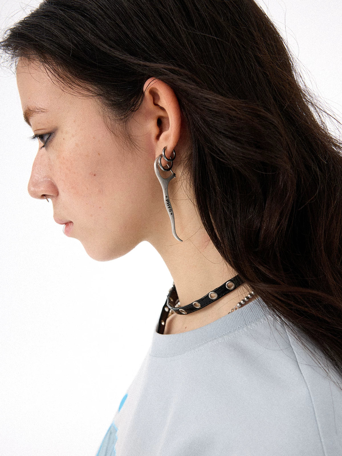 Distressed Dental Floss Pick Earrings - Female model side view