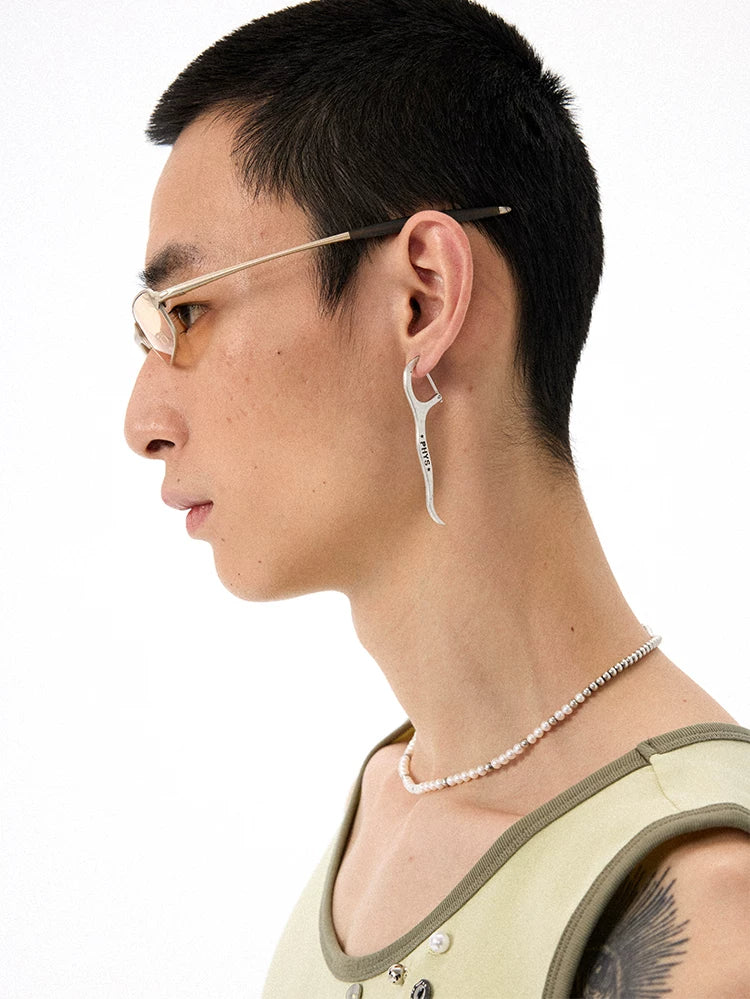 Distressed Dental Floss Pick Earrings - Male model wearing earring