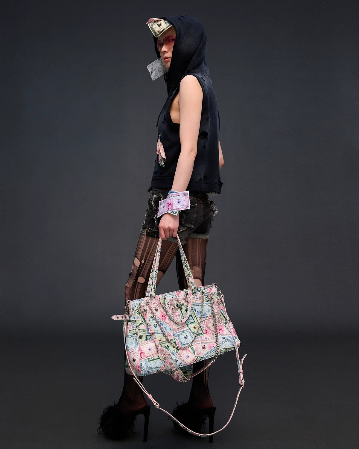 CFIERCE Money Print Multi-Strap Tote Bag - currency-print bag carried at side by model