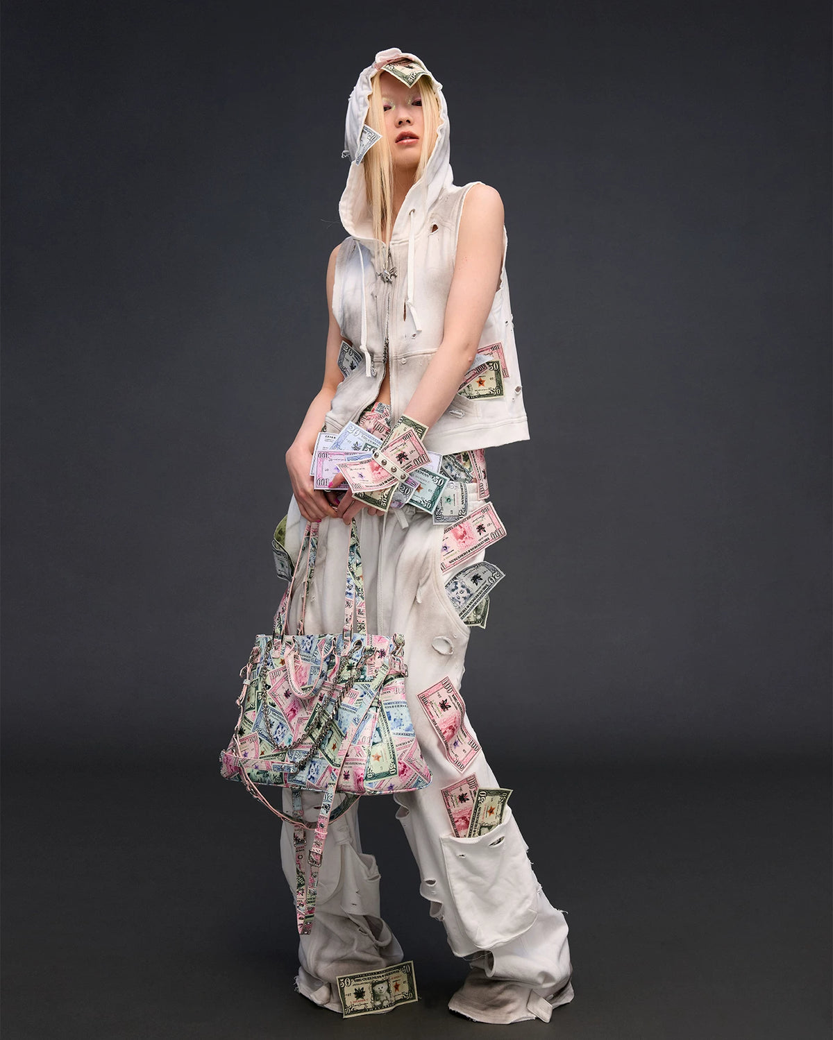 CFIERCE Money Print Multi-Strap Tote Bag - currency-print bag held by side in pale outfit