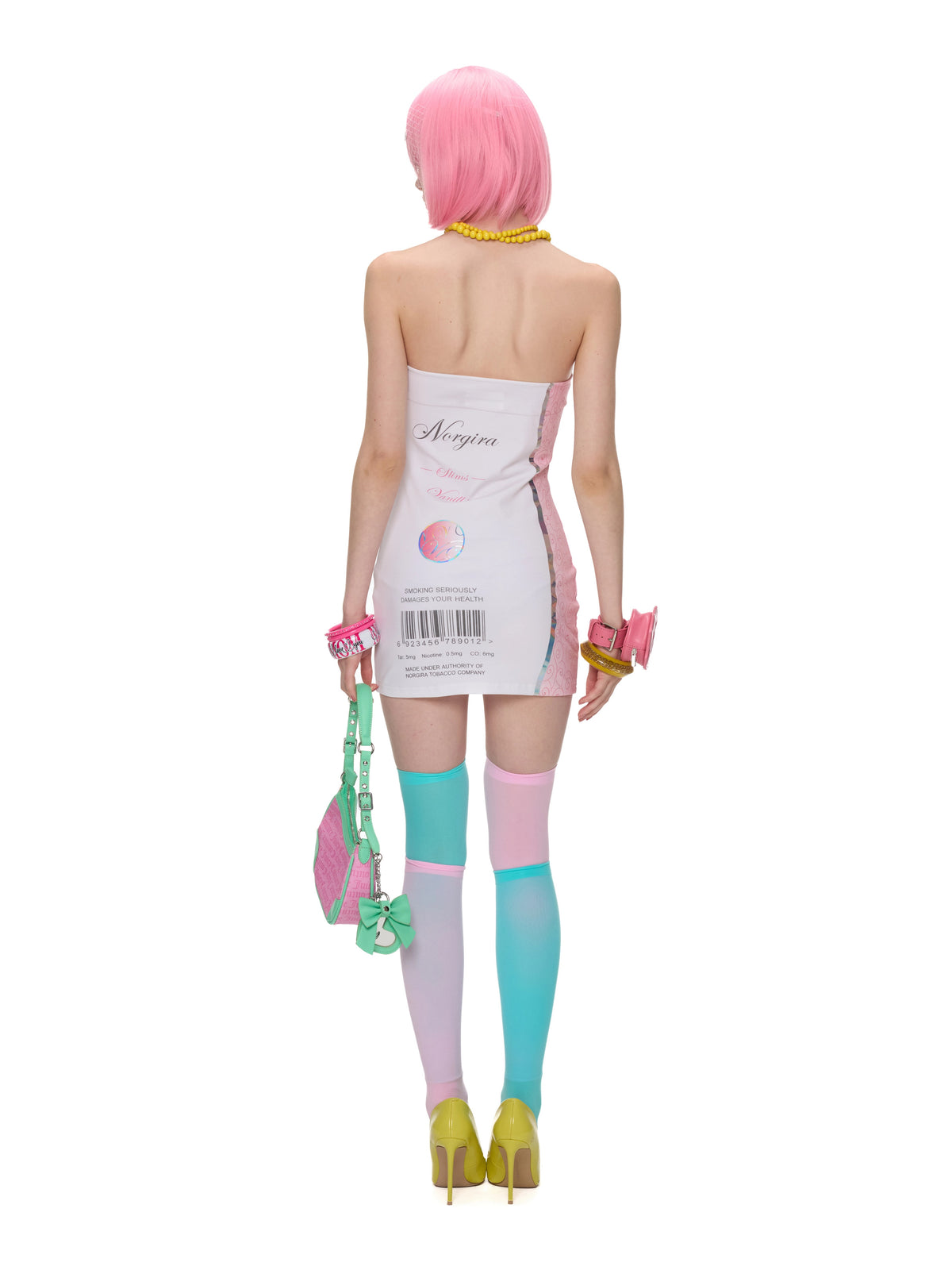 NORGIRA Vanille Cigarette Strapless Mini Dress - white strapless mini dress, rear model view showing package-style back print
