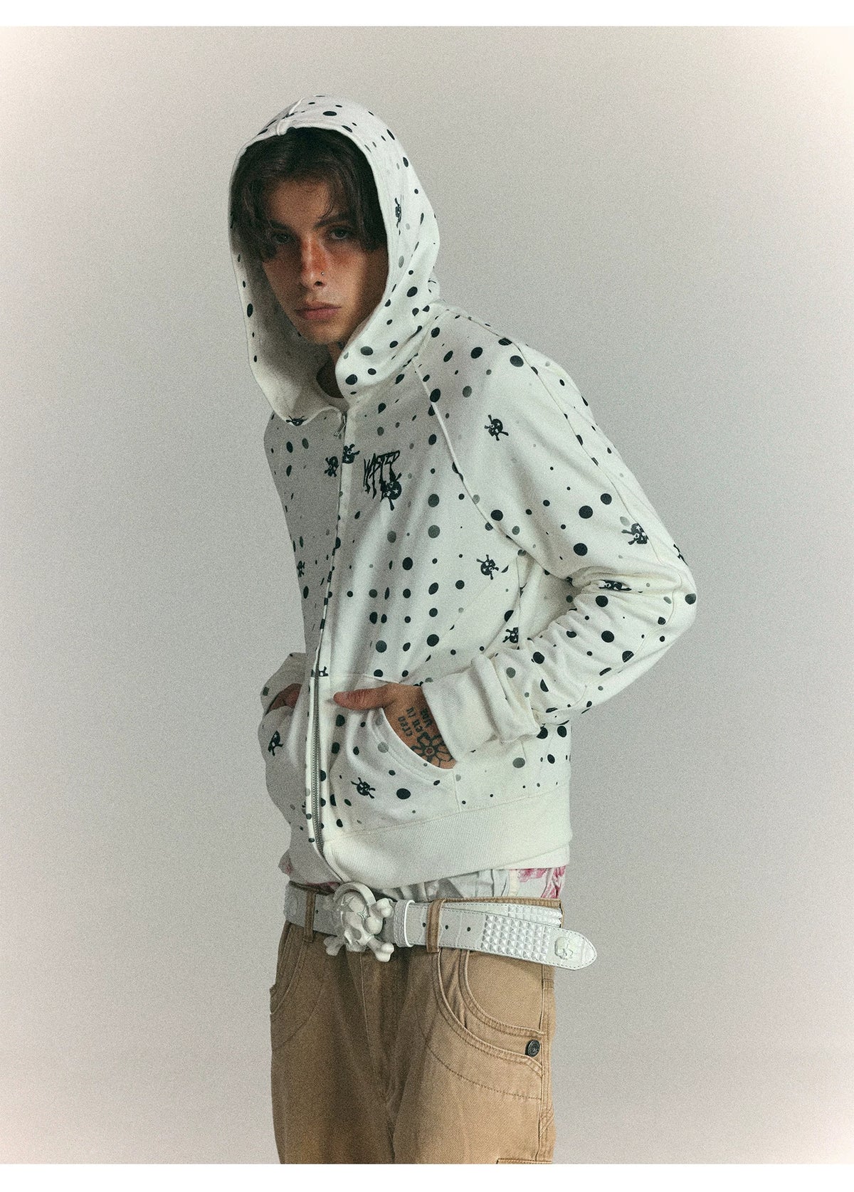 Black polka dot zip hoodie front on model