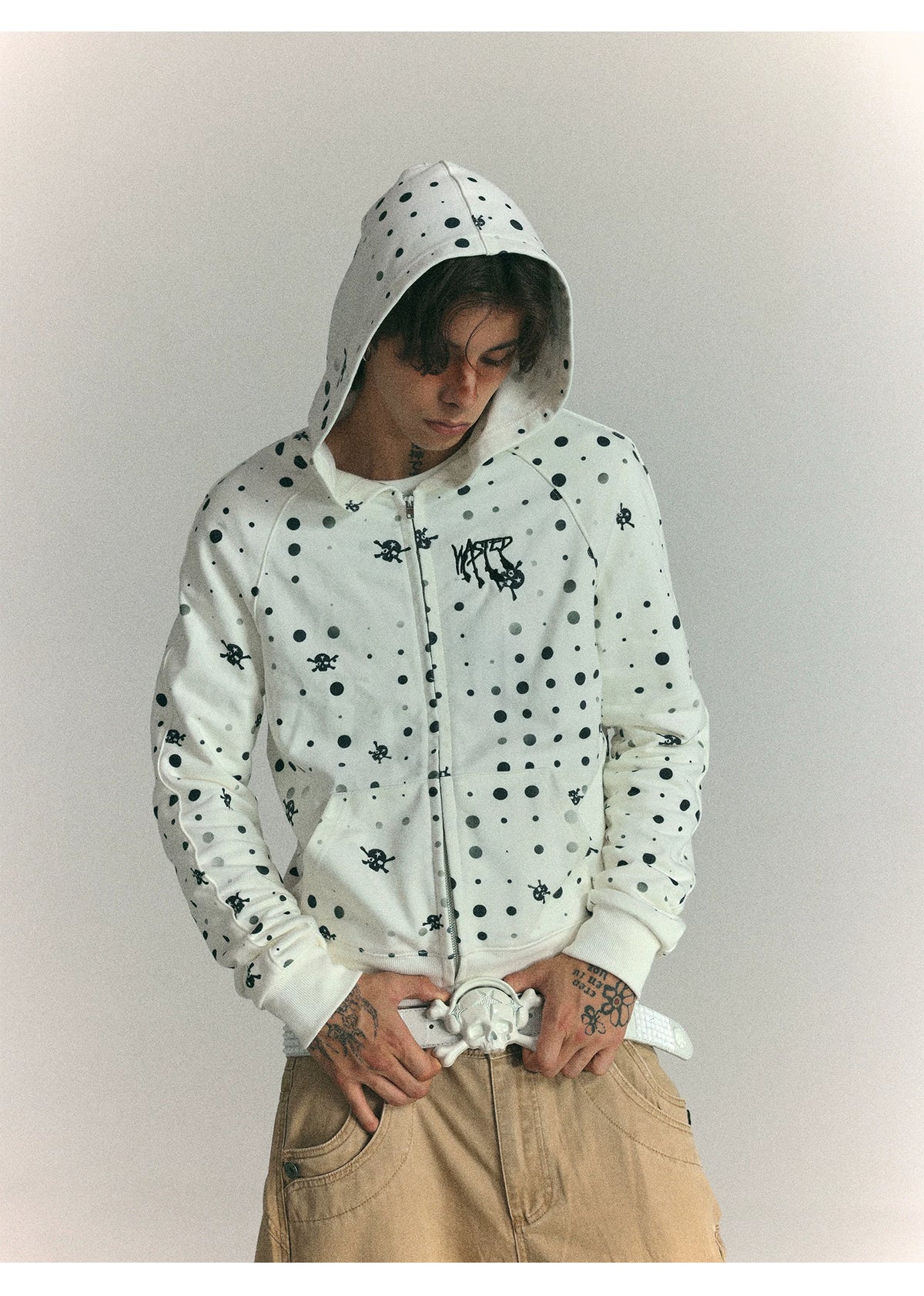 Black polka dot zip hoodie detail on model