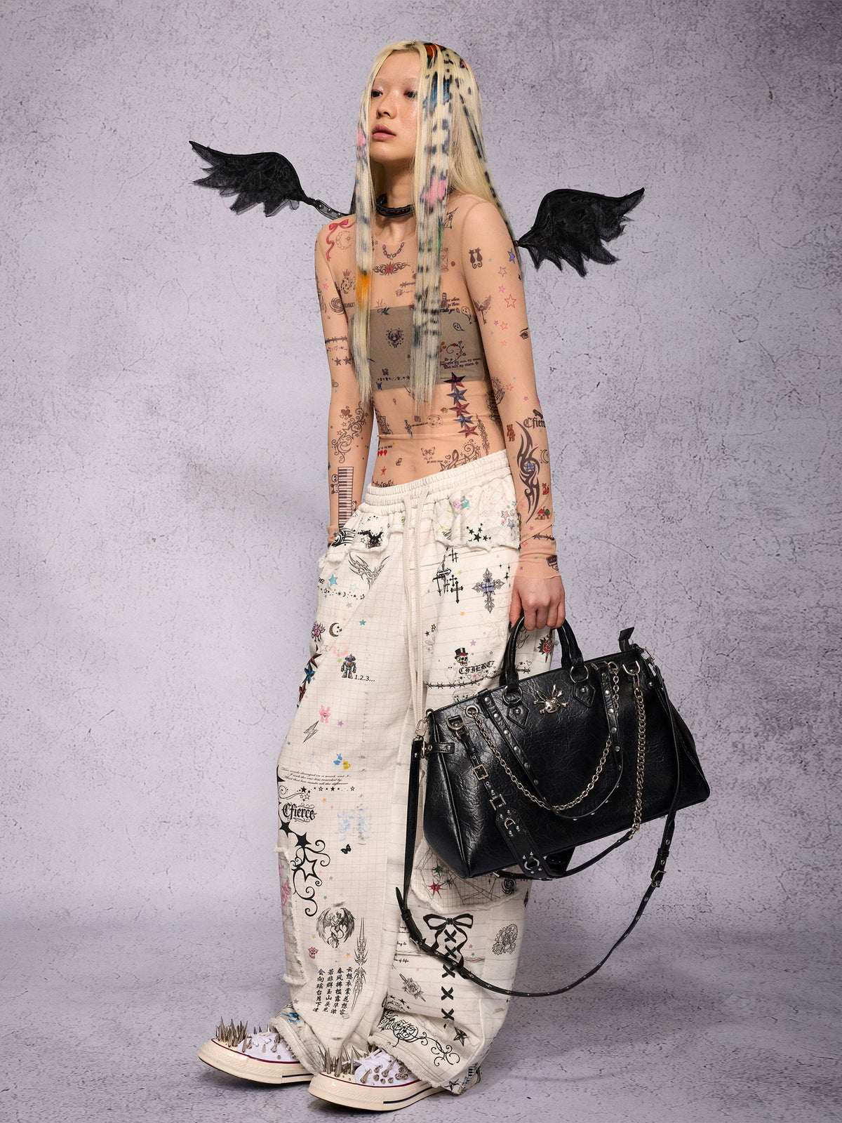 CFIERCE Distressed Manuscript Graphic Sweatpants - white graphic sweatpants side on model