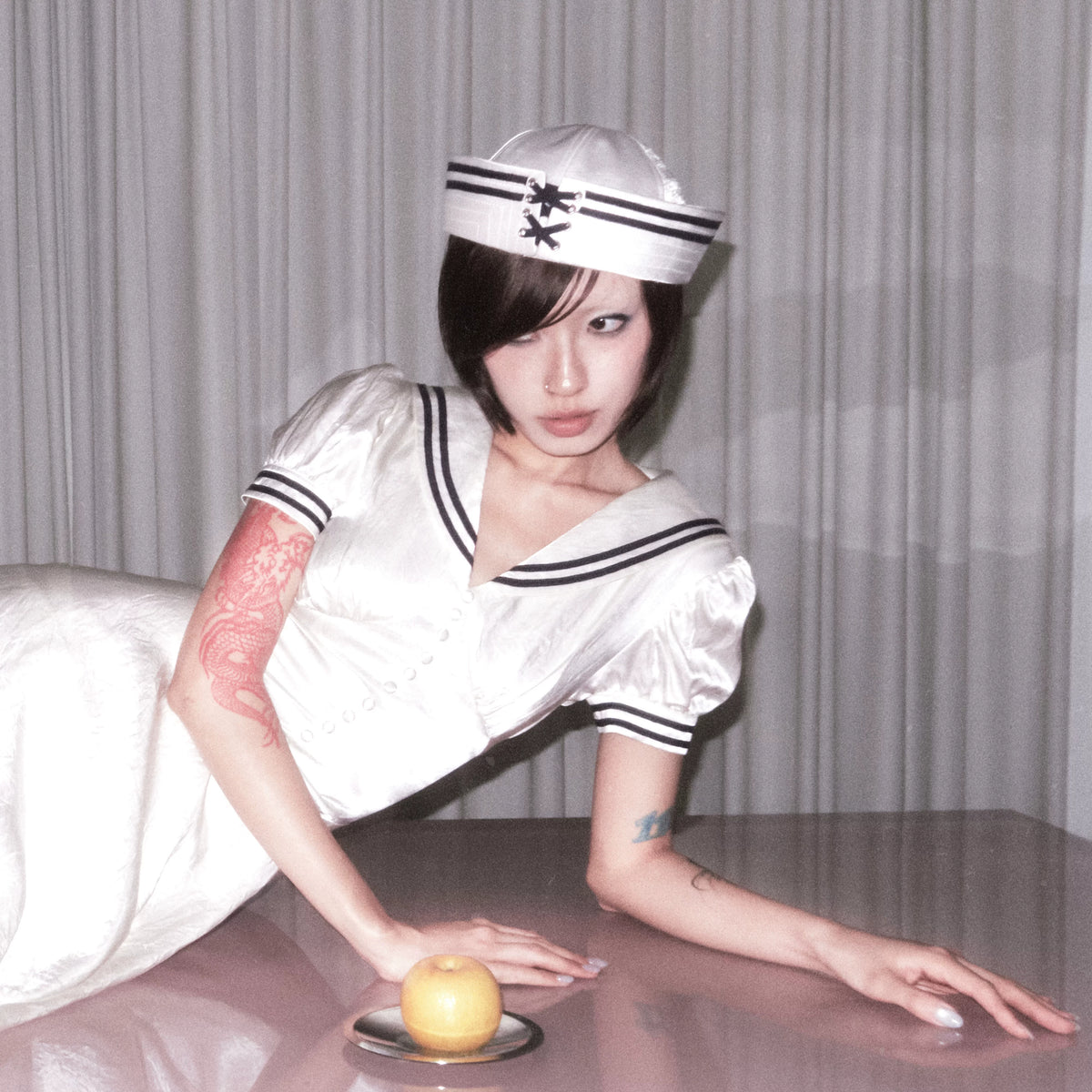 BeatleLady Satin Lace-Up Sailor Hat - Champagne modeled seated