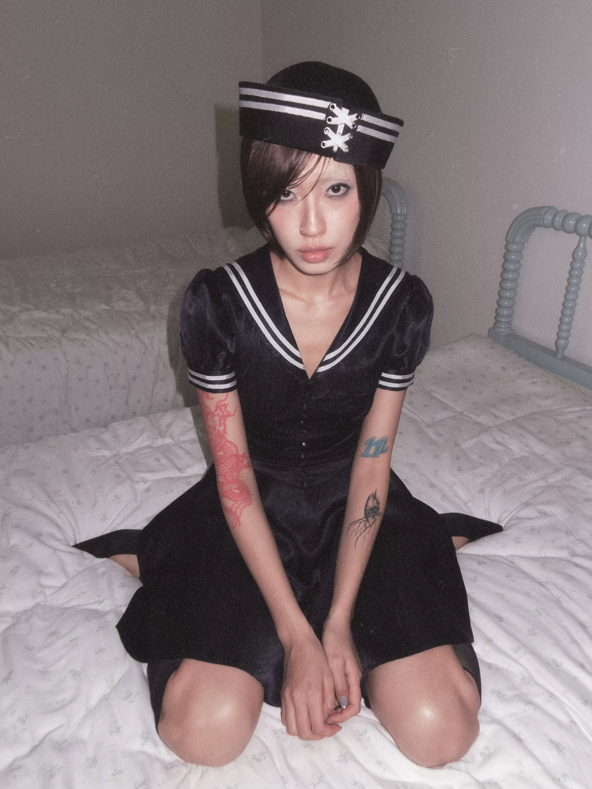 BeatleLady Satin Lace-Up Sailor Hat - Navy modeled seated