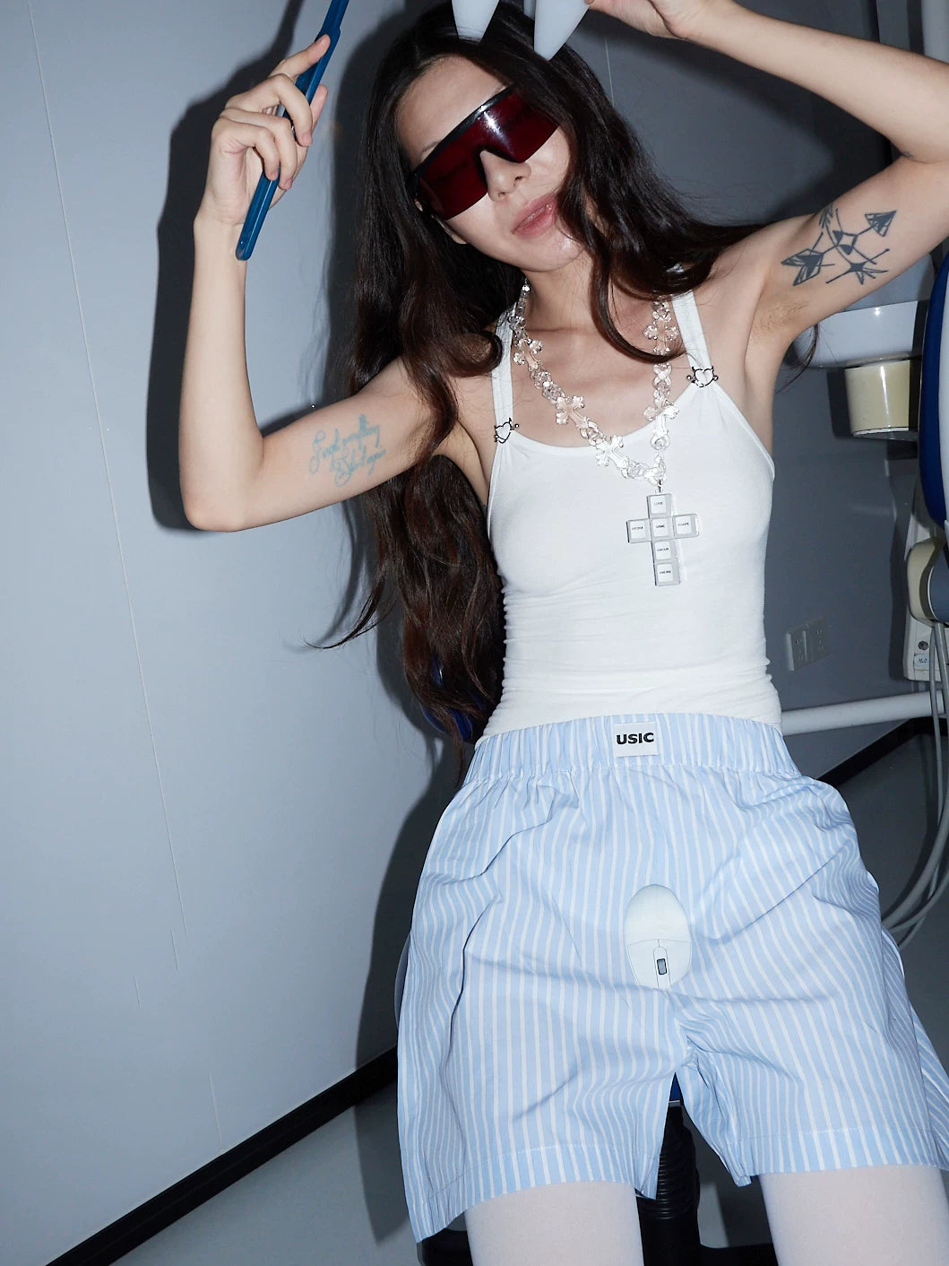 USIC sky blue striped mouse print shorts worn by model