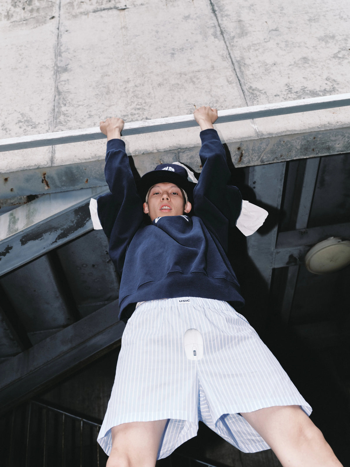 USIC sky blue striped mouse print shorts worn in street look