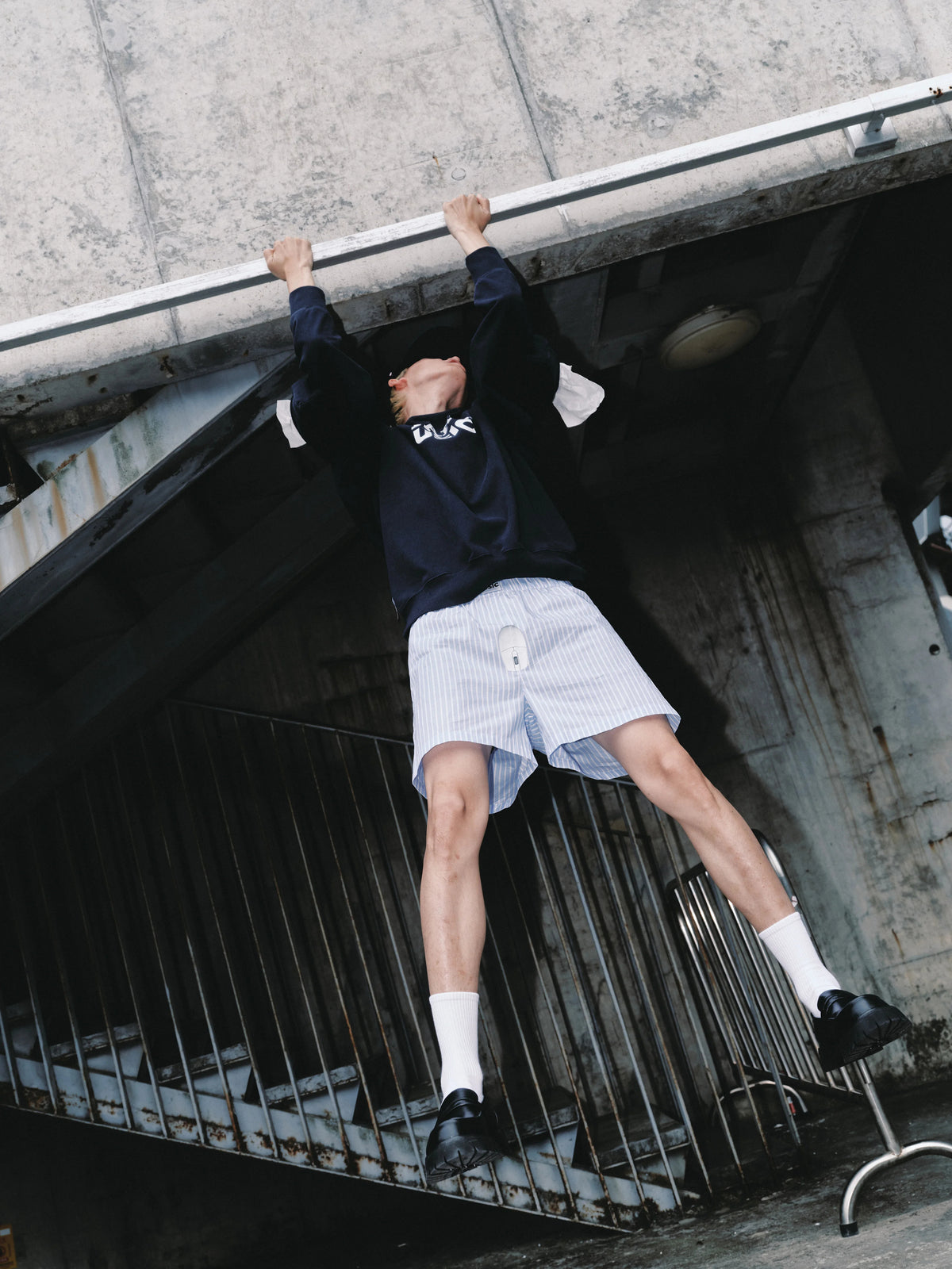 USIC sky blue striped shorts on model, low angle
