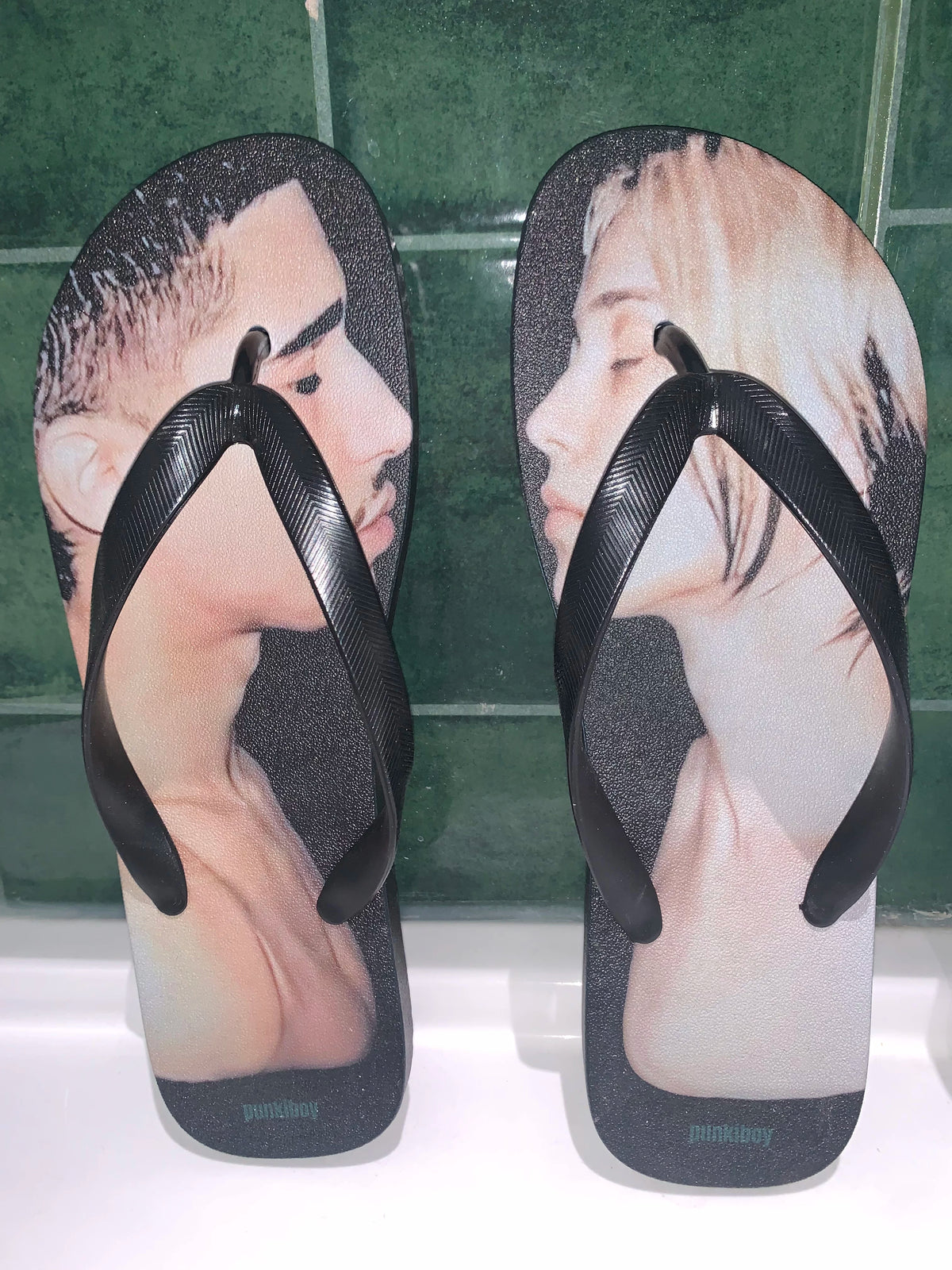 punkiboy Face-to-Face Graphic Flip-Flops - pair against dark tile
