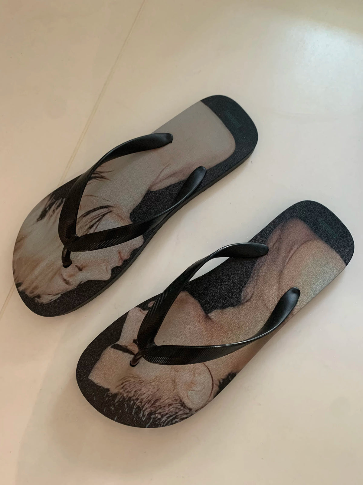 punkiboy Face-to-Face Graphic Flip-Flops - angled view on light ground