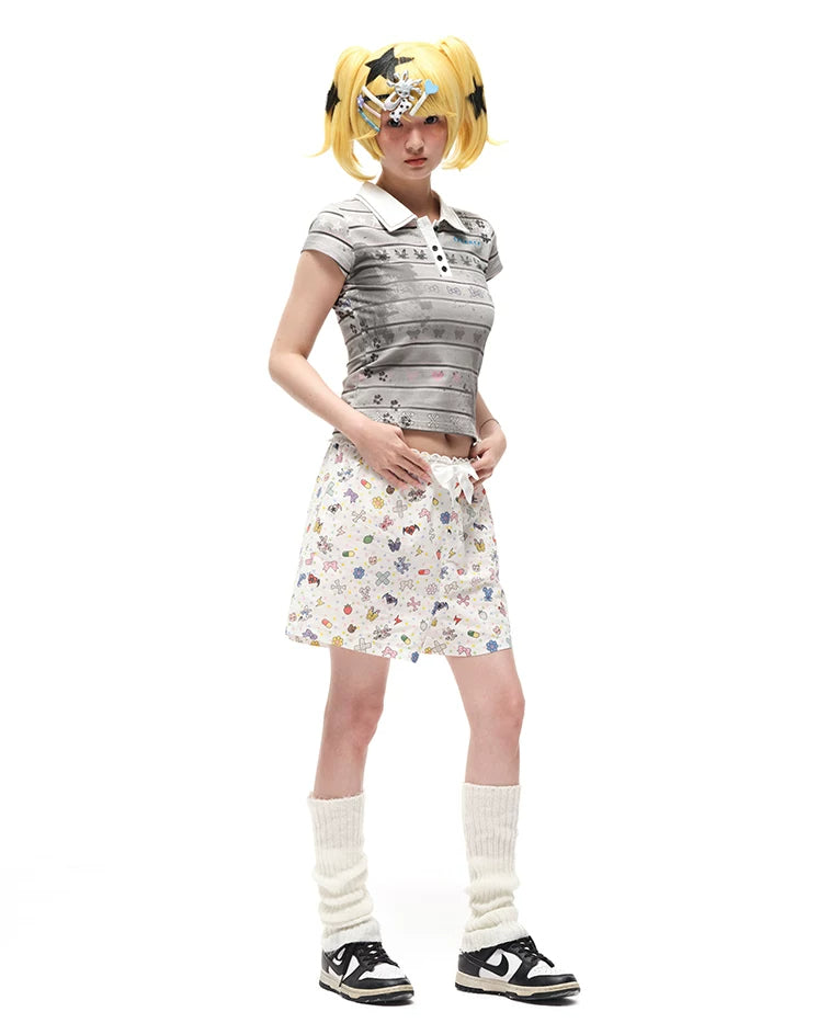 CFIERCE Sticker-Doodle Bow-Waist Shorts - sticker-print shorts in angled styling view