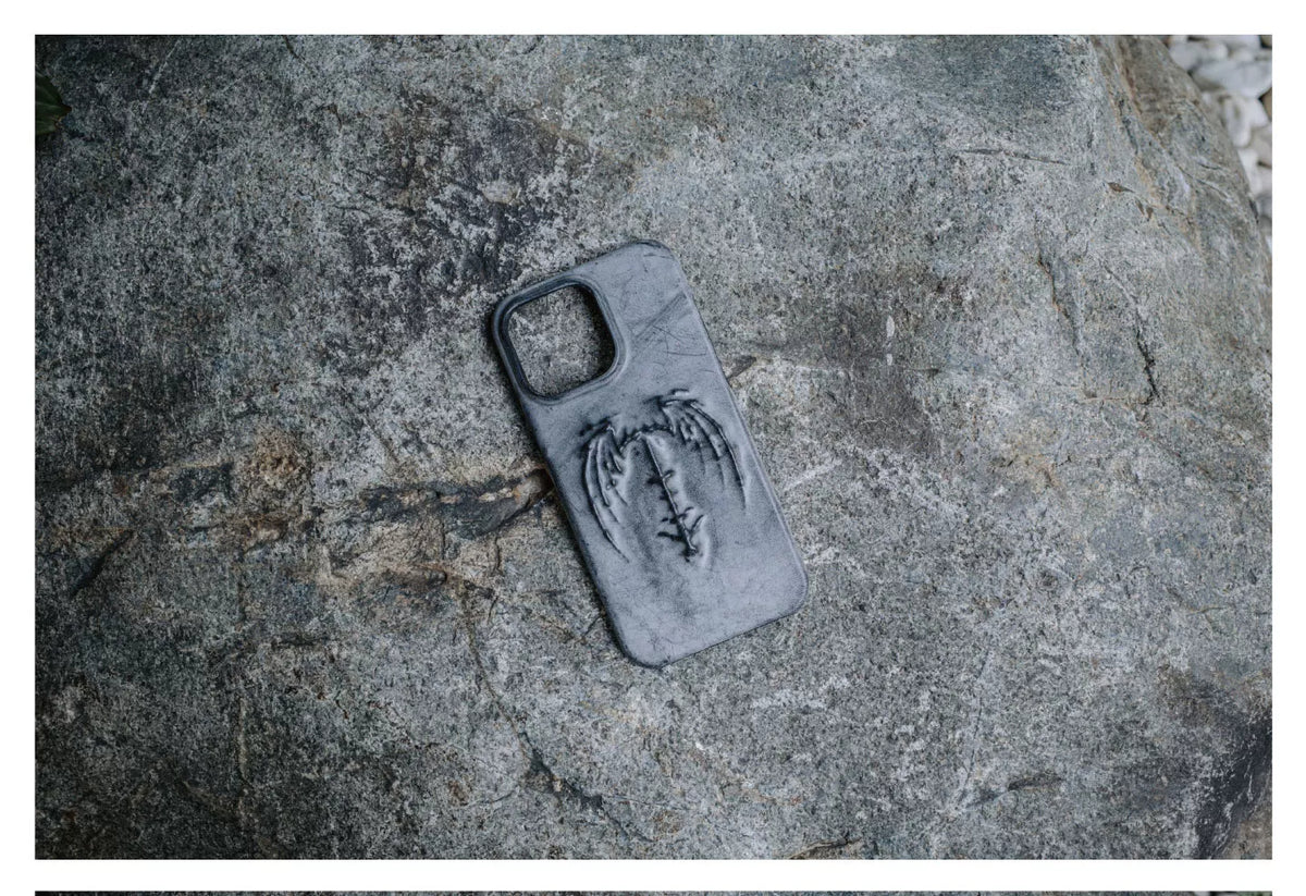Gray-black case detail on stone