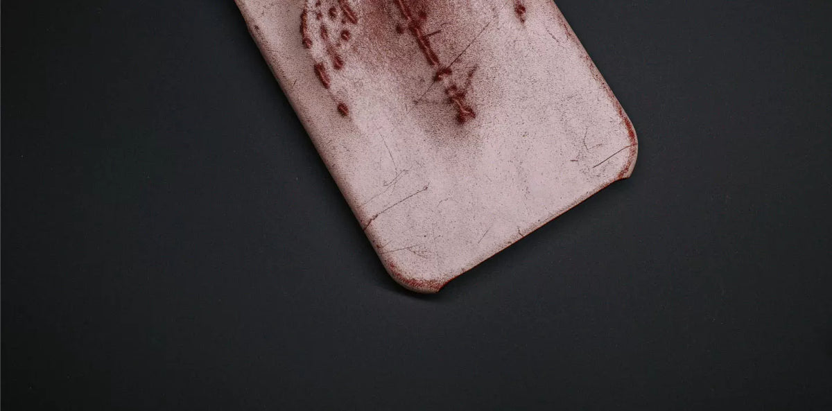 Rubbed red case embossed wing detail