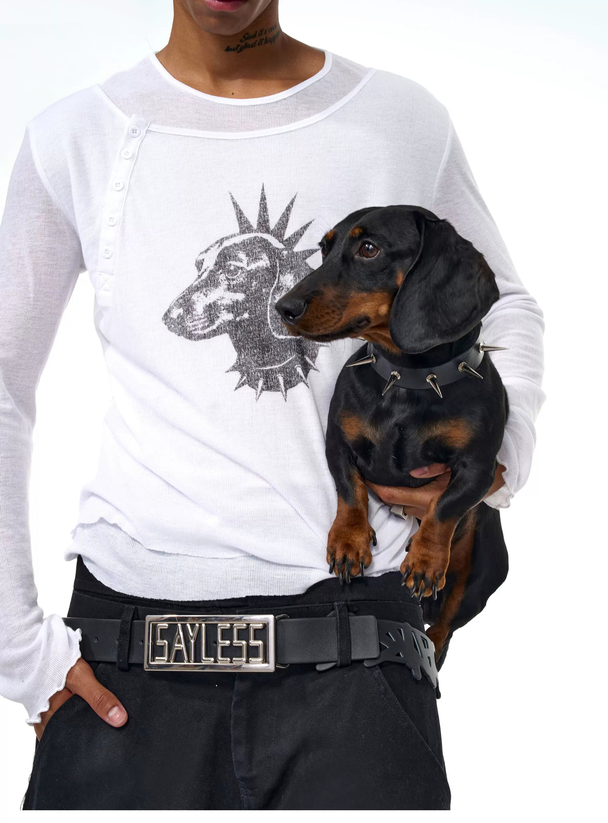 White graphic tee with dachshund print beside a real dog