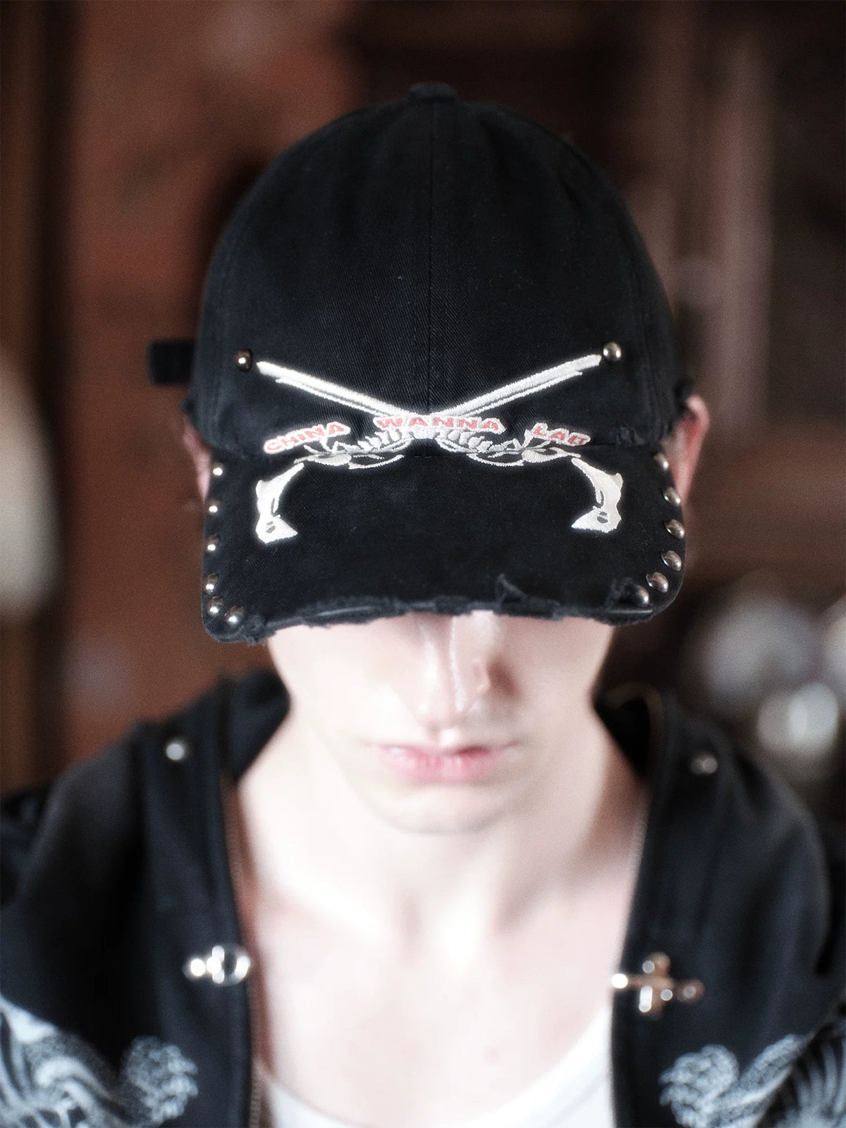 WANNA LAB Bone Pistols Embroidered Studded Washed Denim Cap - Washed Black on model front, looking down