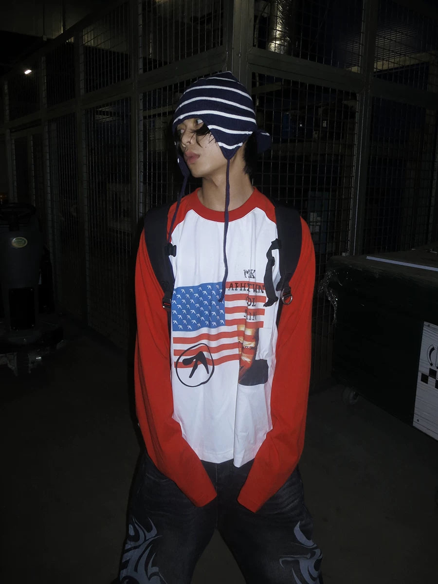 RAINMAKE Flag Parody Graphic Raglan Long Sleeve Tee - White on model