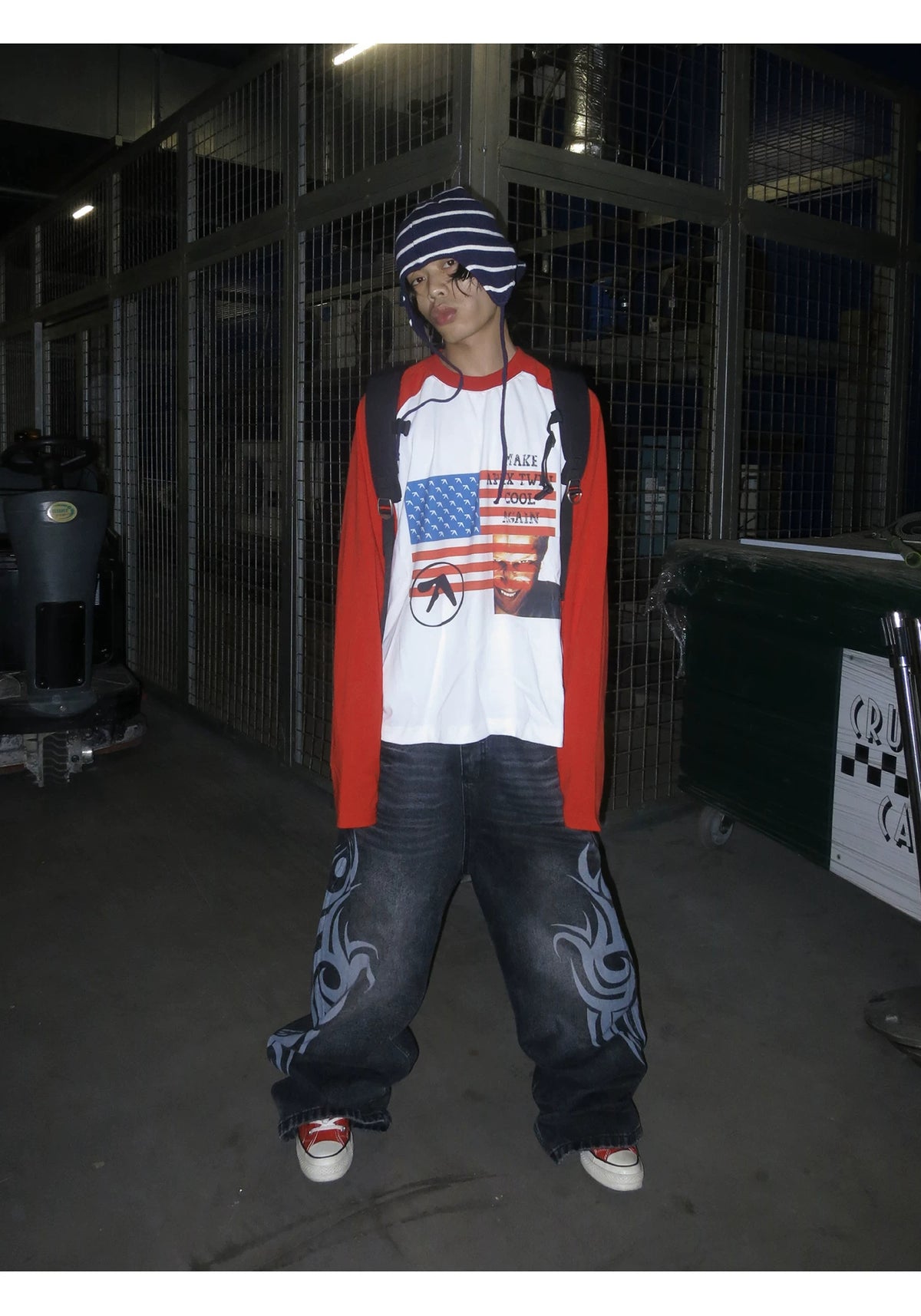 RAINMAKE Flag Parody Graphic Raglan Long Sleeve Tee - White on model