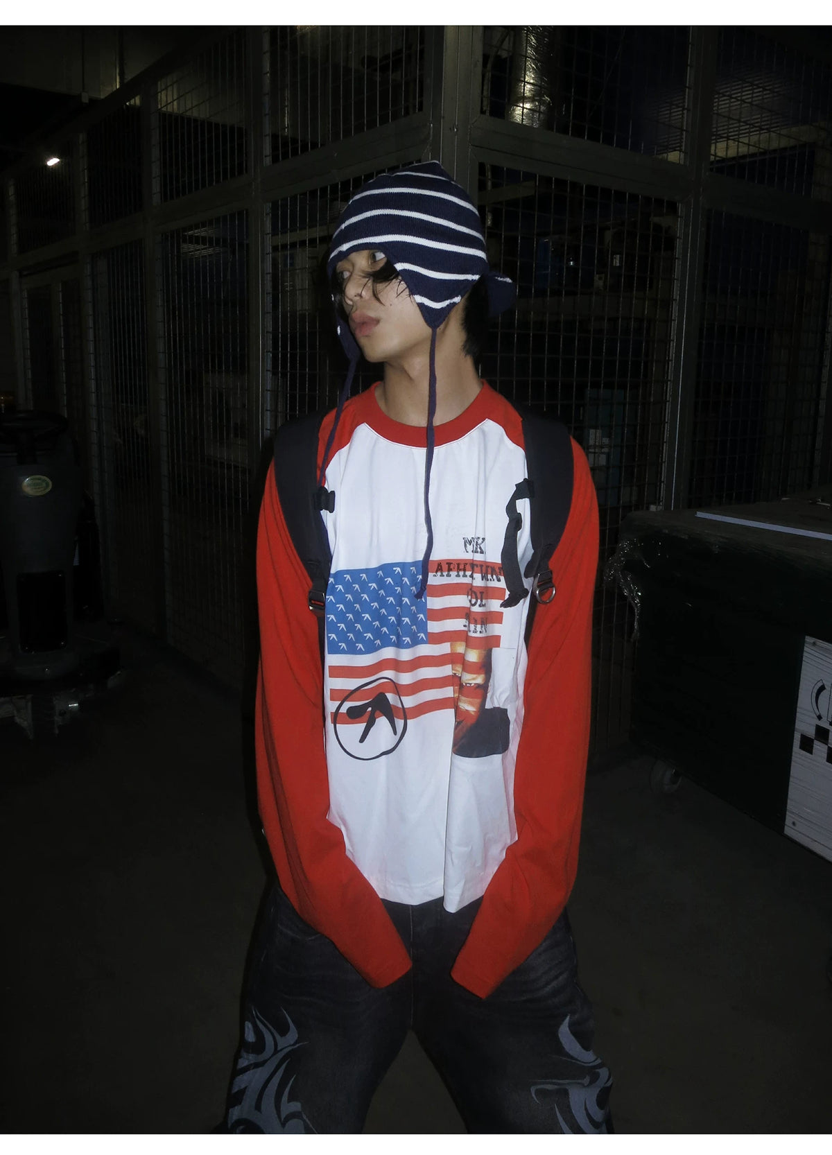 RAINMAKE Flag Parody Graphic Raglan Long Sleeve Tee - White on model