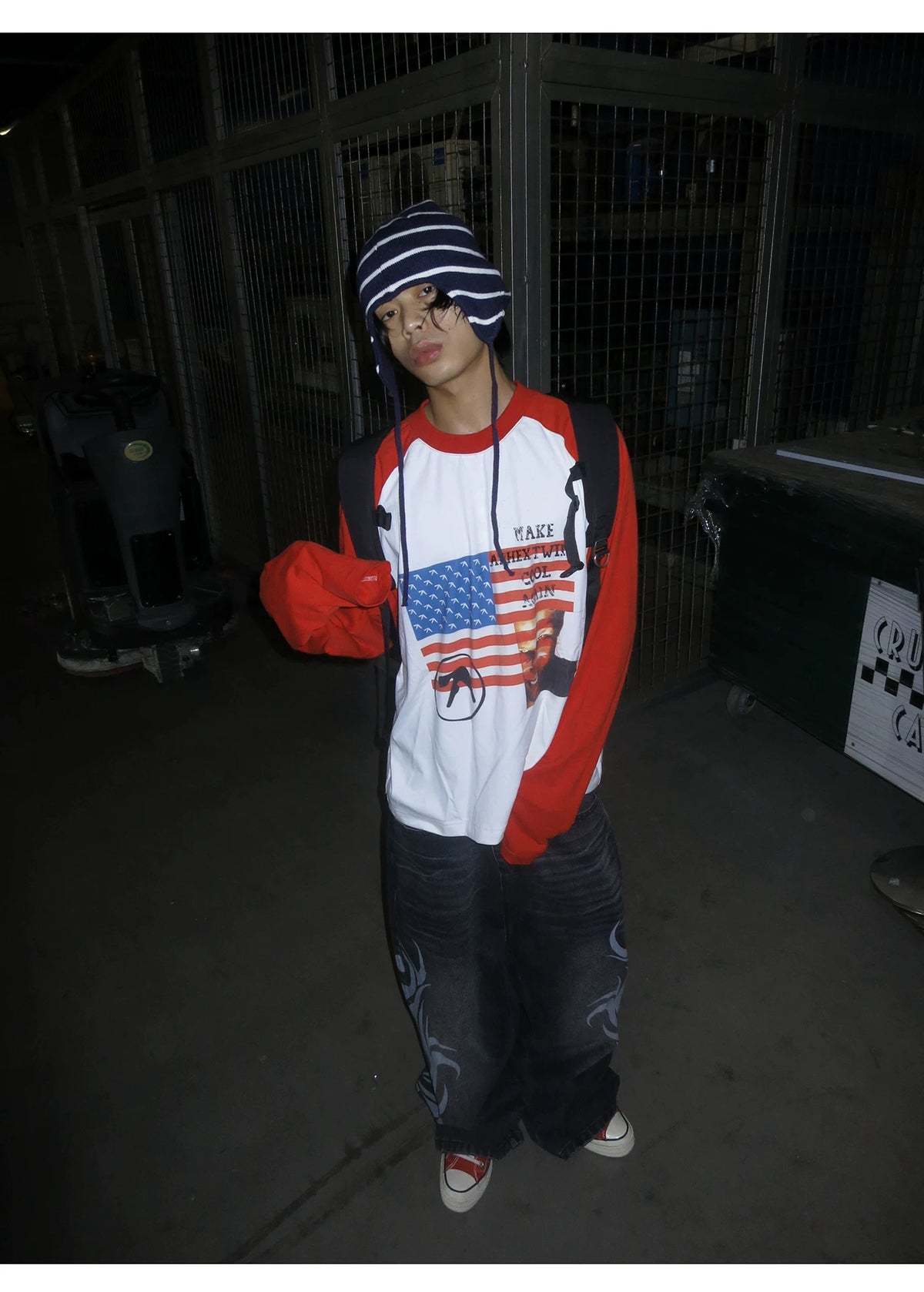 RAINMAKE Flag Parody Graphic Raglan Long Sleeve Tee - White on model