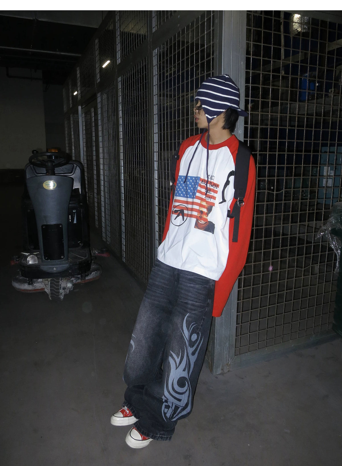 RAINMAKE Flag Parody Graphic Raglan Long Sleeve Tee - White on model