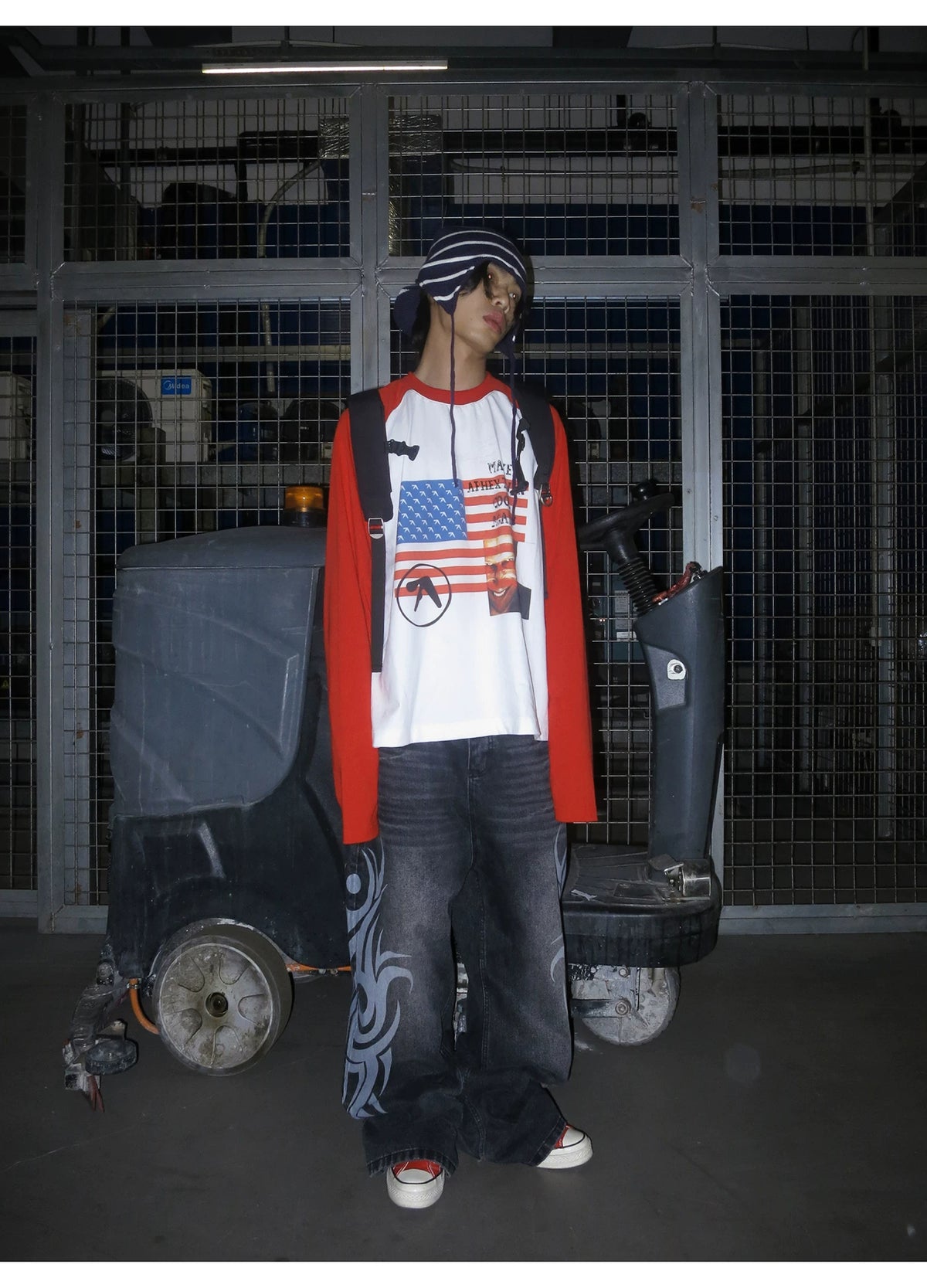 RAINMAKE Flag Parody Graphic Raglan Long Sleeve Tee - White on model