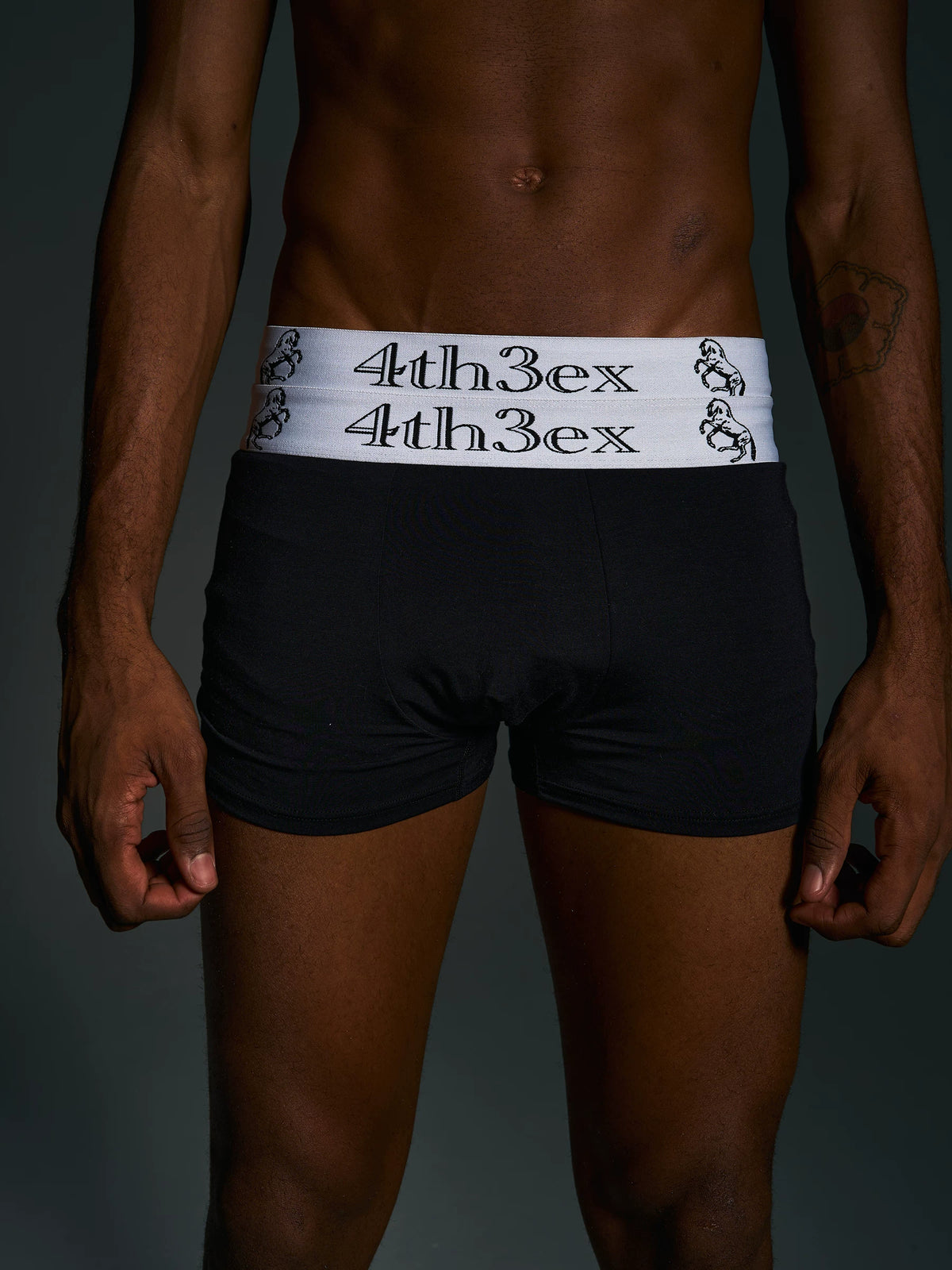 Front view of Fourth3ex black boxer briefs with double white horse-embroidered waistband