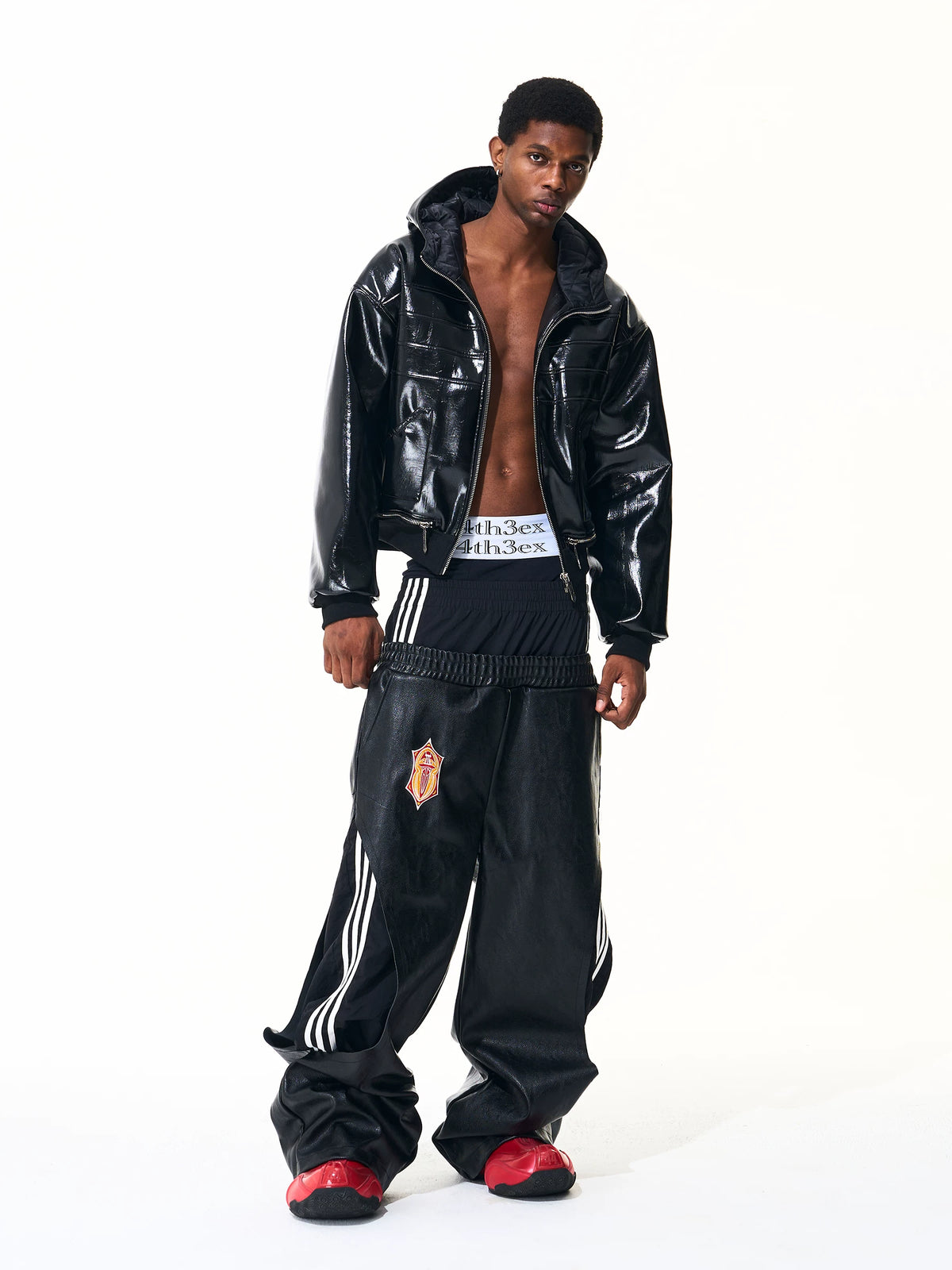 Full outfit showing black wide-leg pants with layered waistband