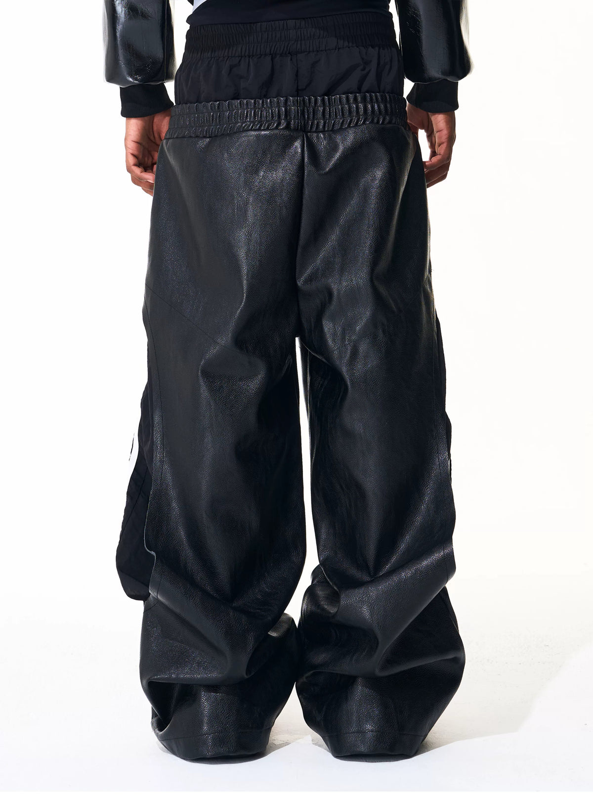 Close rear view of black wide-leg pants and double waistband