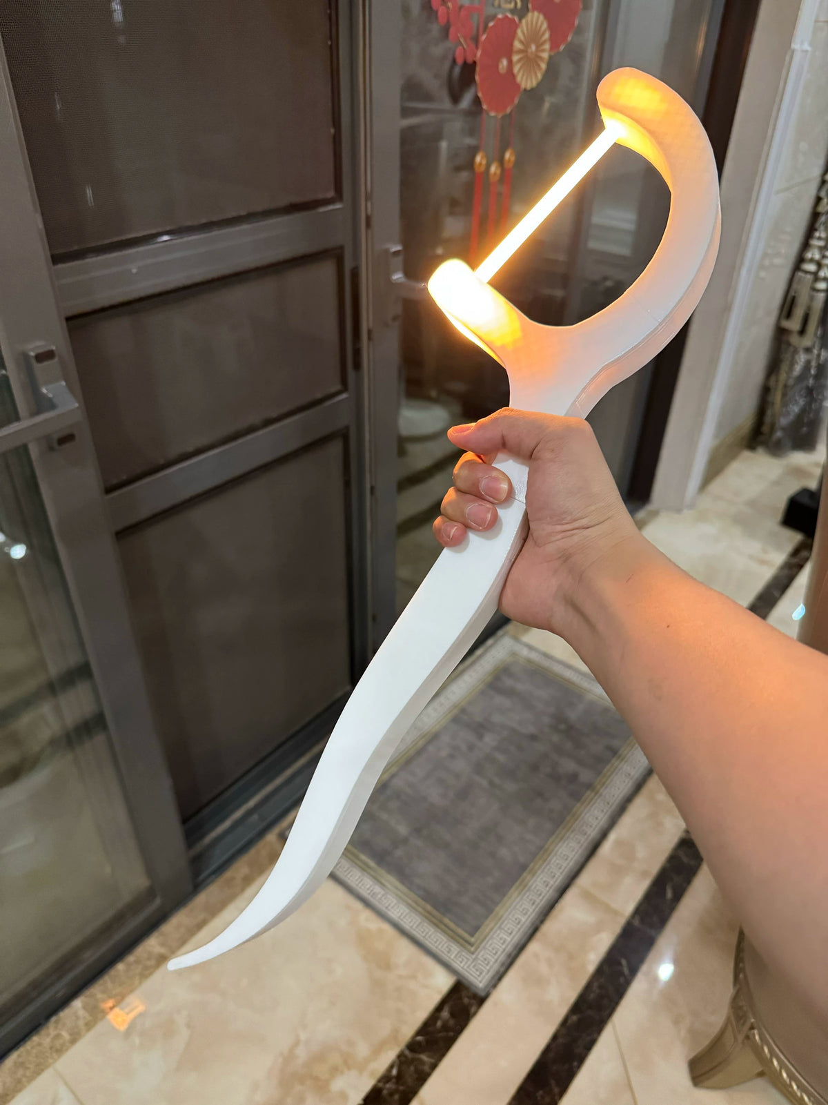 White dental-floss-pick decor with warm light