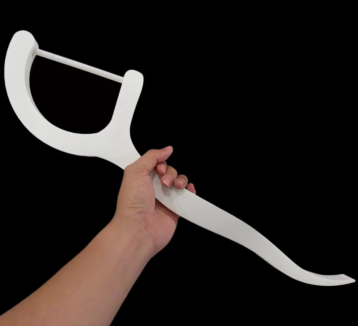 White dental-floss-pick-shaped decor without light