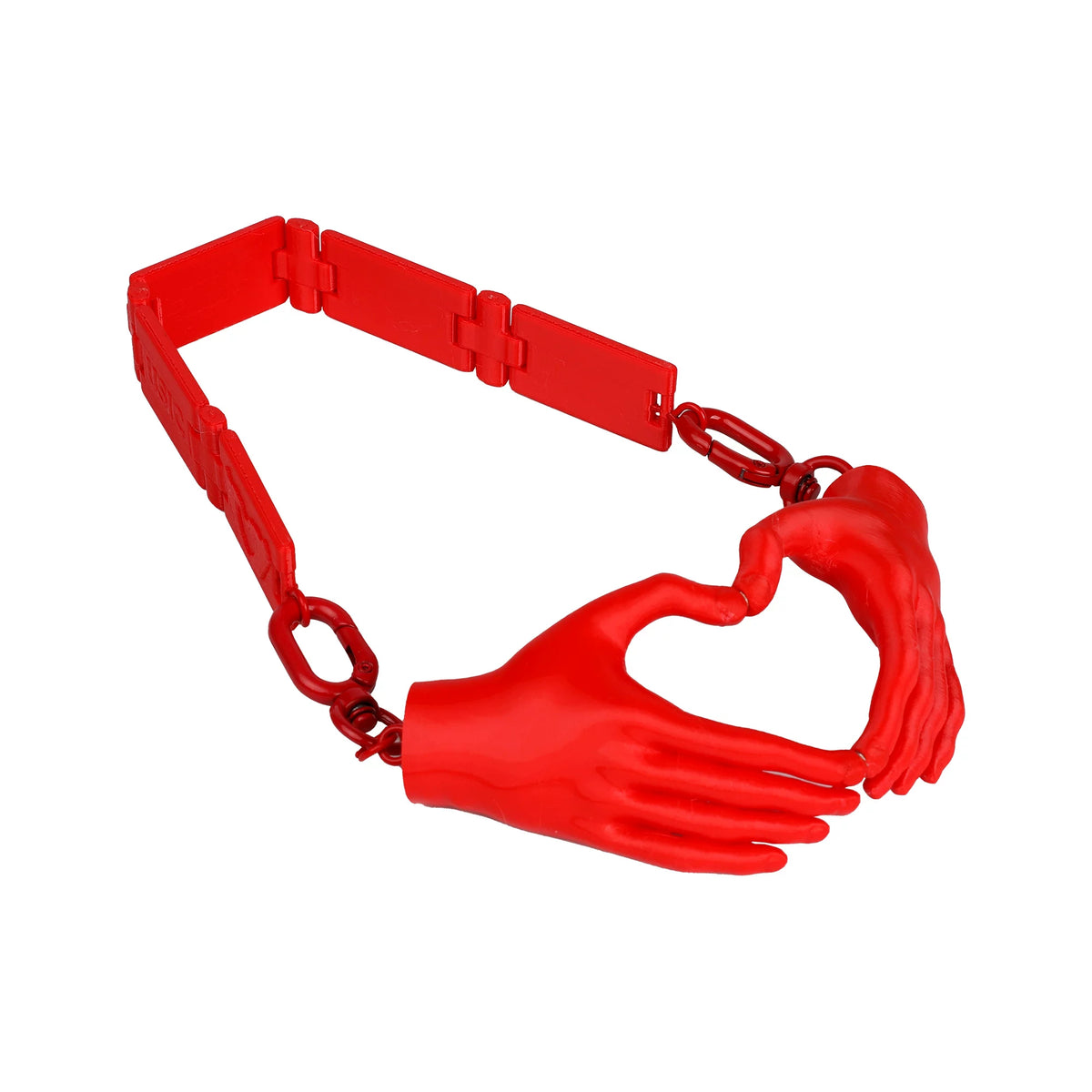 Red heart hands necklace on white background, angled view