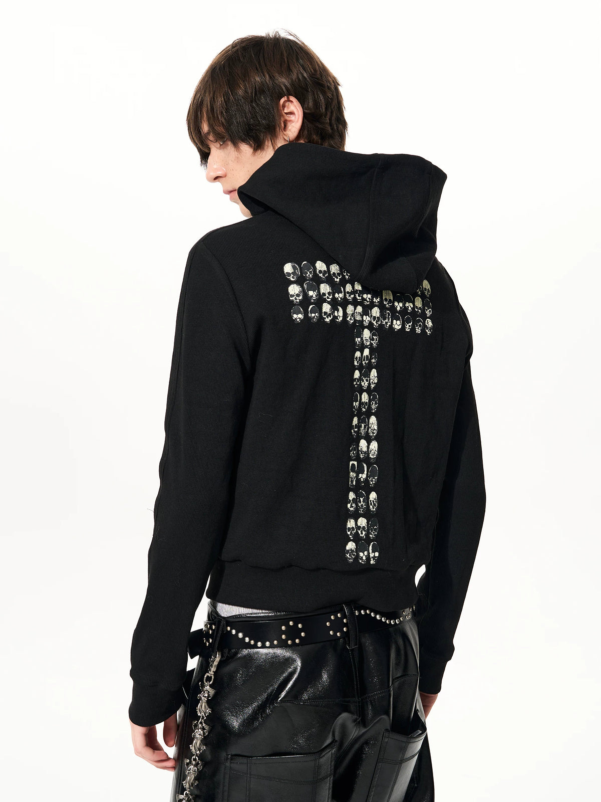 Angled back view of skull-cross graphic on black hoodie
